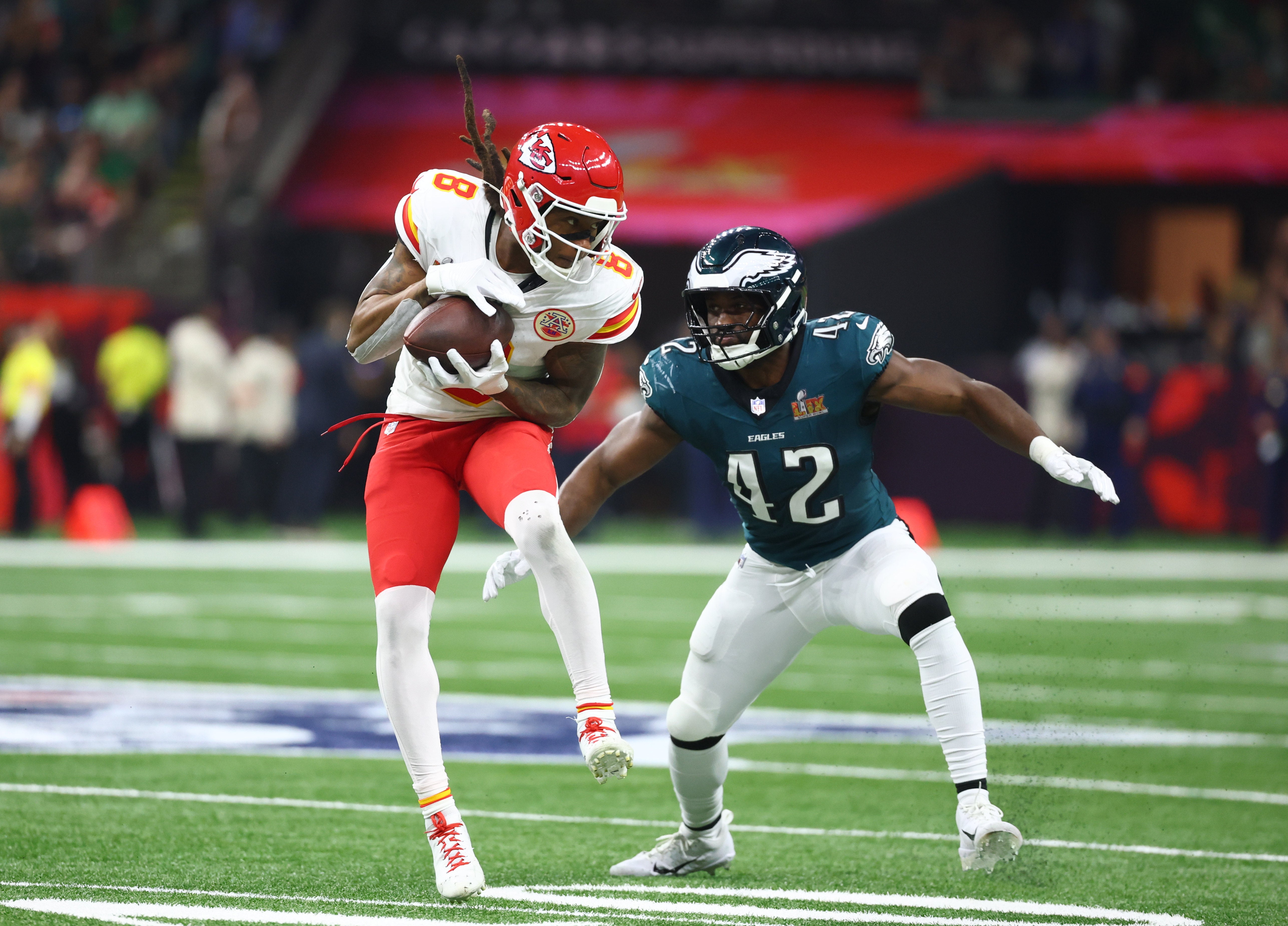 Feb 9, 2025; New Orleans, LA, USA; Kansas City Chiefs wide receiver DeAndre Hopkins (8) catches a pass against Philadelphia Eagles linebacker Oren Burks (42) in the third quarter in Super Bowl LIX at Ceasars Superdome.
