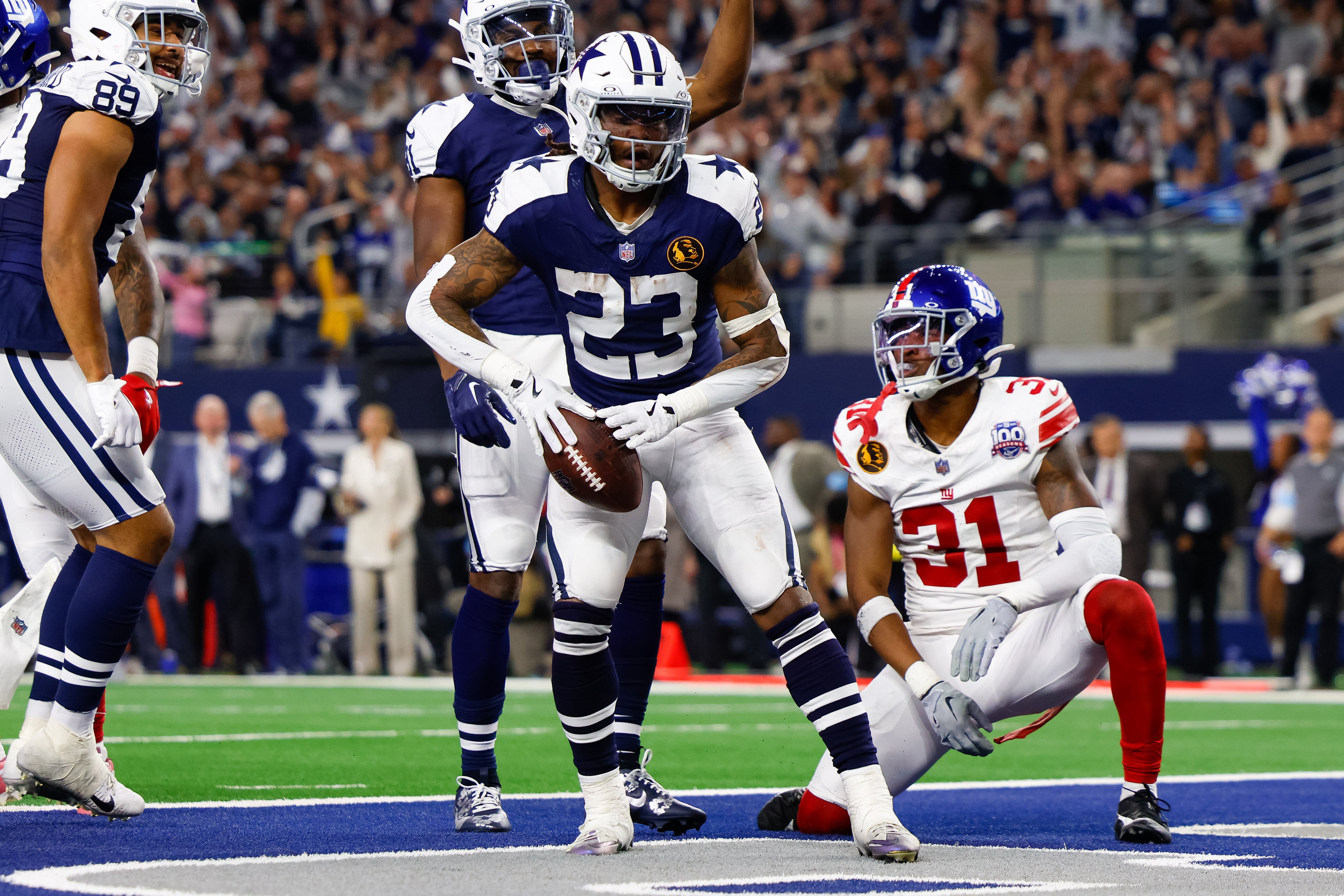 Dallas Cowboys running back Rico Dowdle (23) rushes for a touchdown during the third quarter against the New York Giants at AT&T Stadium.