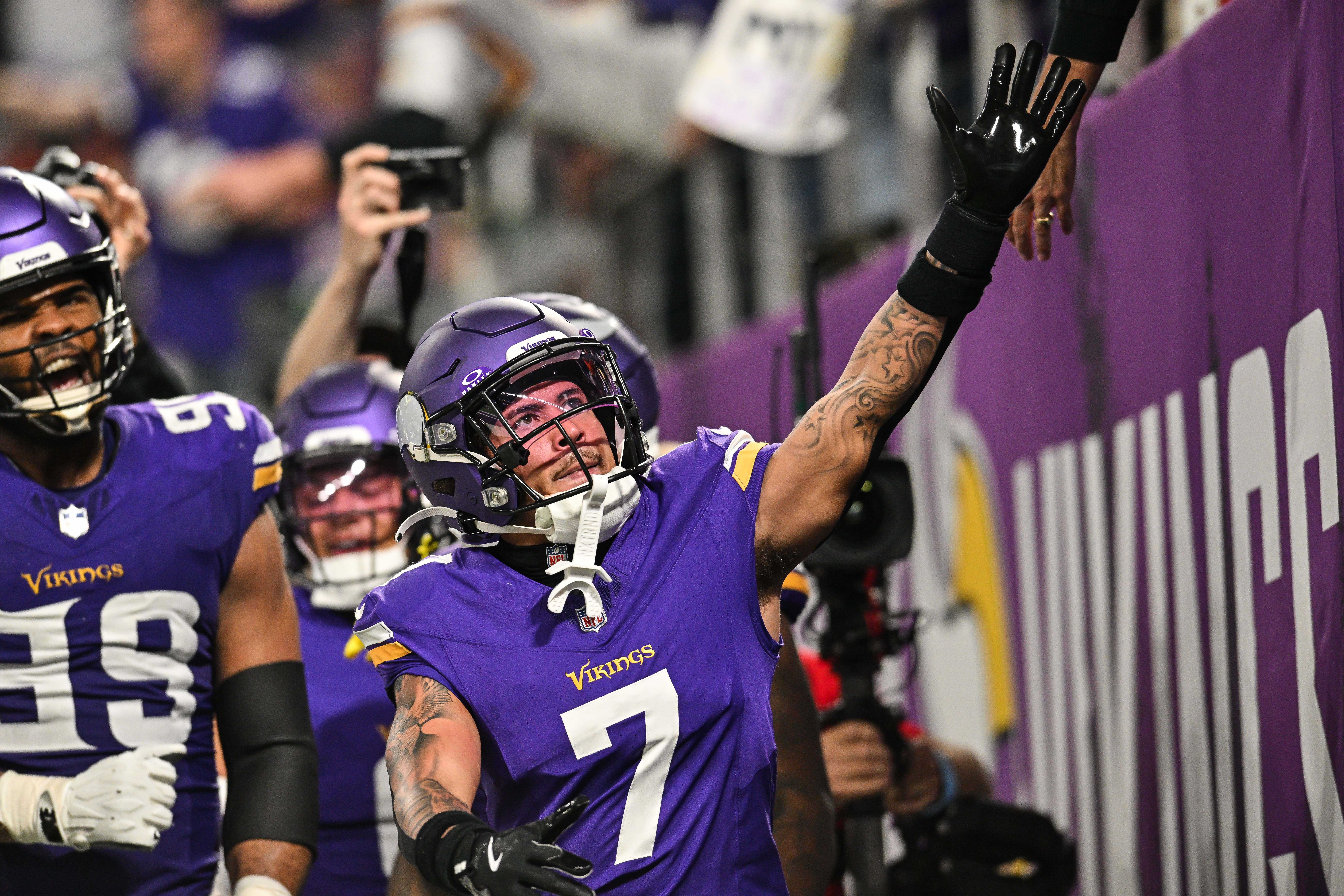 Nov 3, 2024; Minneapolis, Minnesota, USA; Minnesota Vikings cornerback Byron Murphy Jr. (7) reacts with the crowd after an interception off Indianapolis Colts quarterback Joe Flacco (not pictured) during the third quarter at U.S. Bank Stadium.