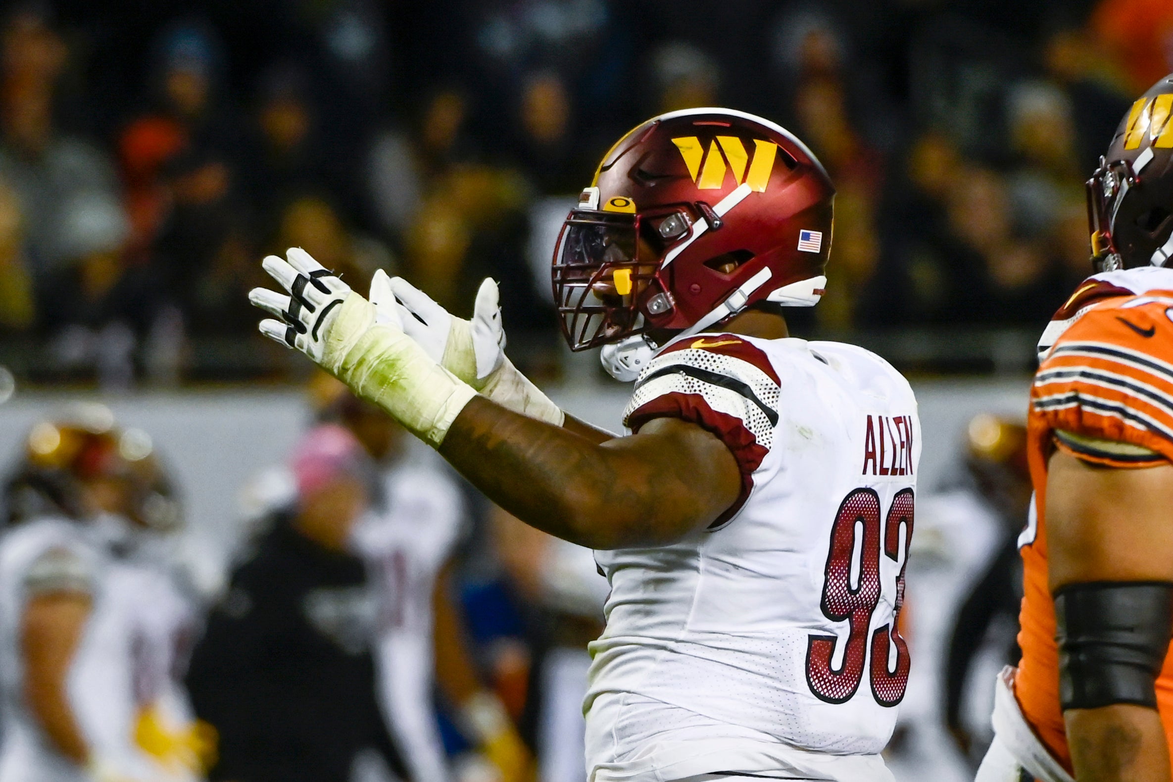 Oct 13, 2022; Chicago, Illinois, USA; Washington Commanders defensive tackle Jonathan Allen (93) reacts after sacking Chicago Bears quarterback Justin Fields (1) during the second half at Soldier Field.