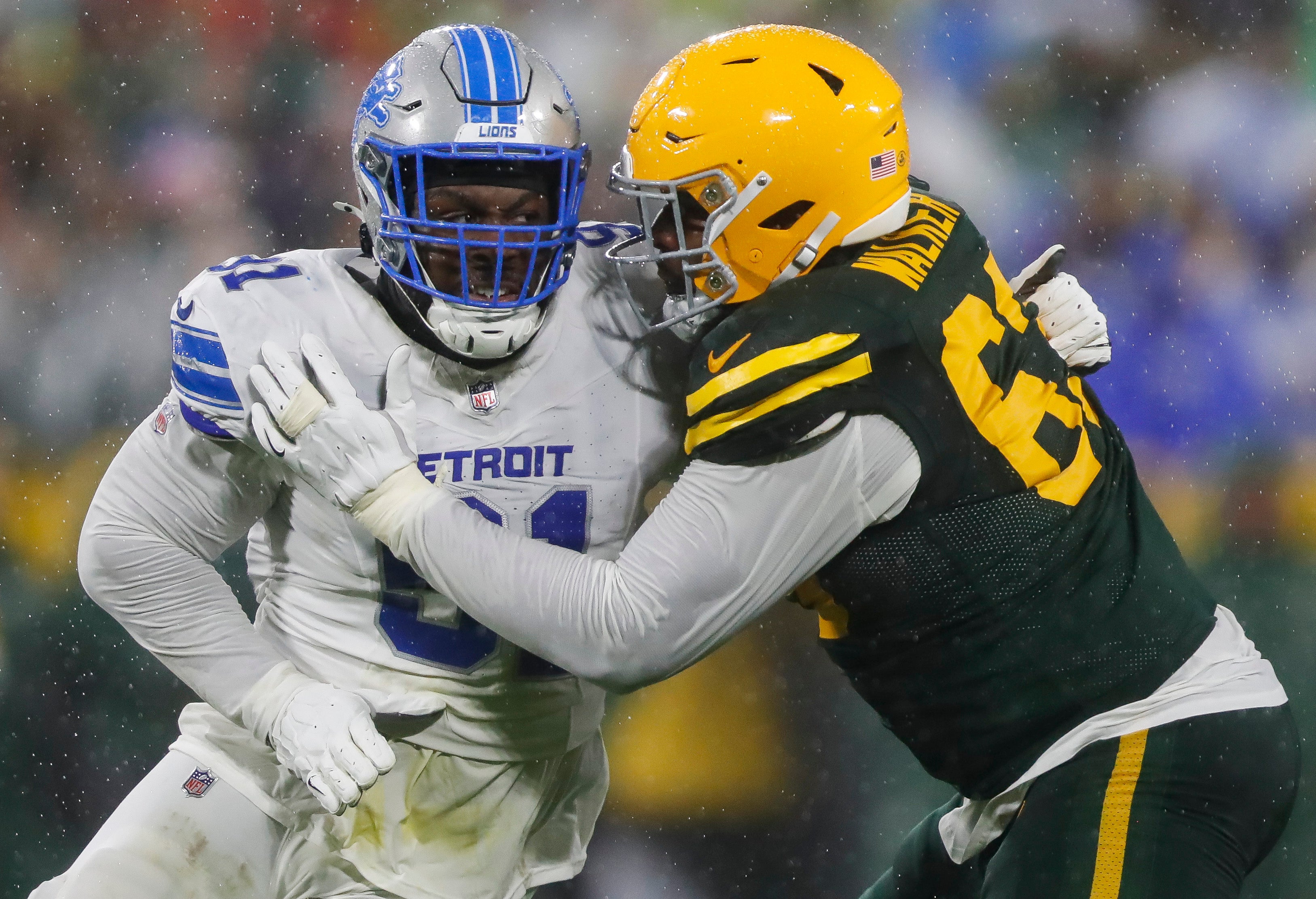 Detroit Lions defensive end Levi Onwuzurike (91) rushes the quarterback as Green Bay Packers offensive tackle Rasheed Walker (63) blocks at Lambeau Field.