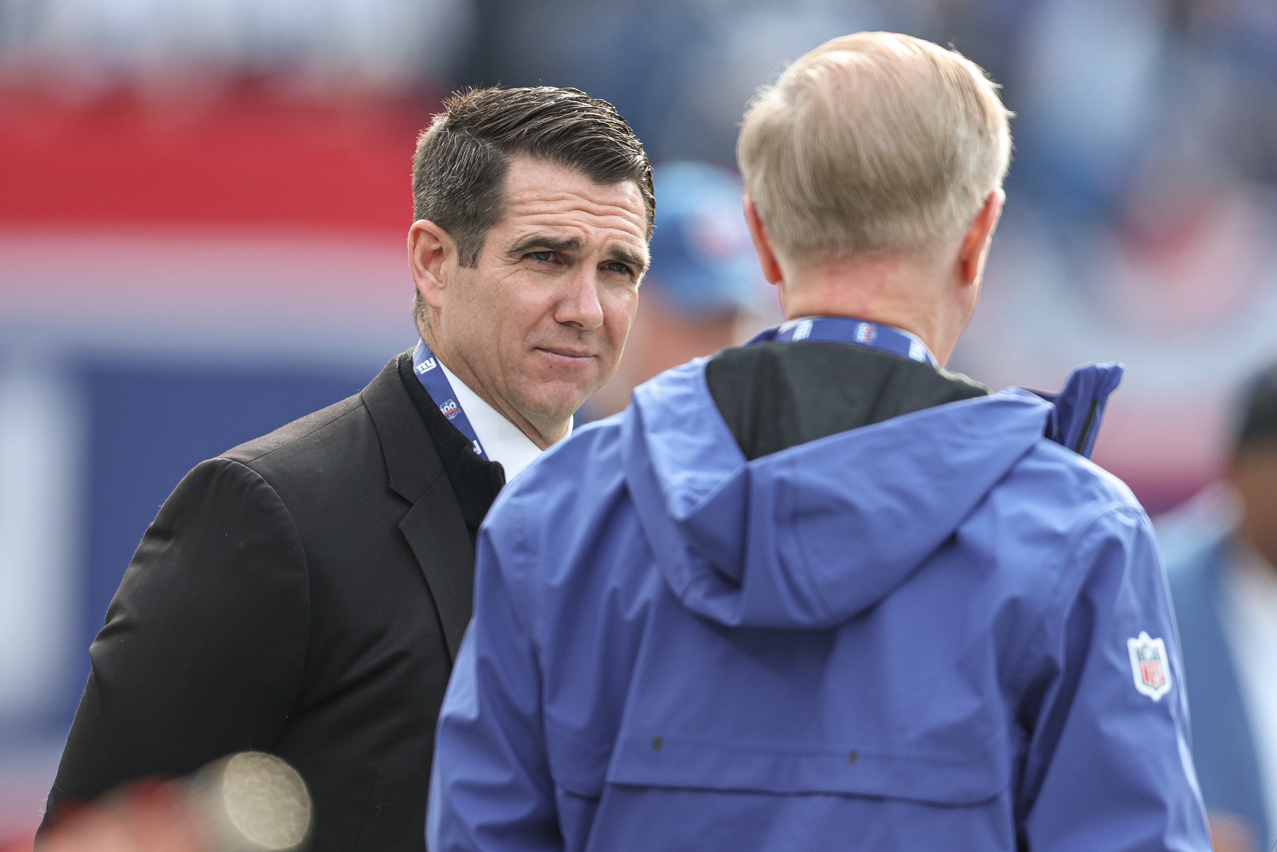 New York Giants owner John Mara, right, and general manager Joe Schoen, left, talk before the game against the Indianapolis Colts at MetLife Stadium.
