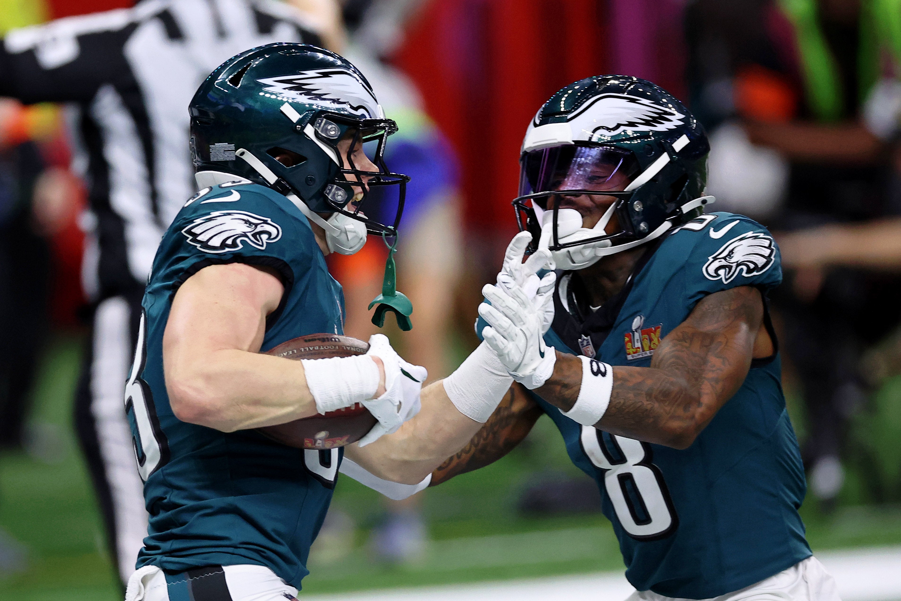 Philadelphia Eagles cornerback Cooper DeJean (33) is congratulated by safety C.J. Gardner-Johnson (8) after scoring a touchdown after making an interception during the first half of Super Bowl LIX.