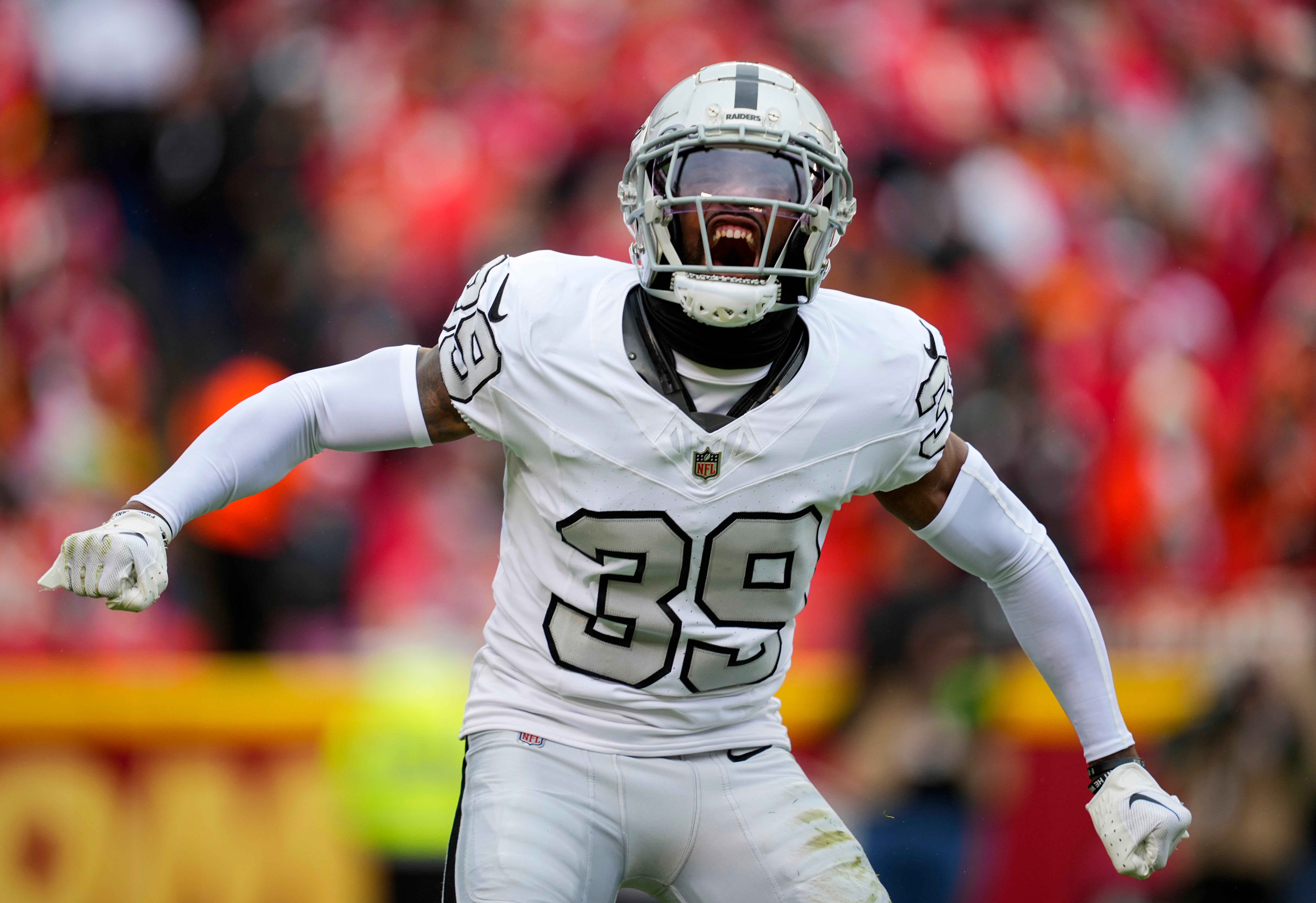Las Vegas Raiders cornerback Nate Hobbs (39) celebrates during the first half against the Kansas City Chiefs at GEHA Field at Arrowhead Stadium.
