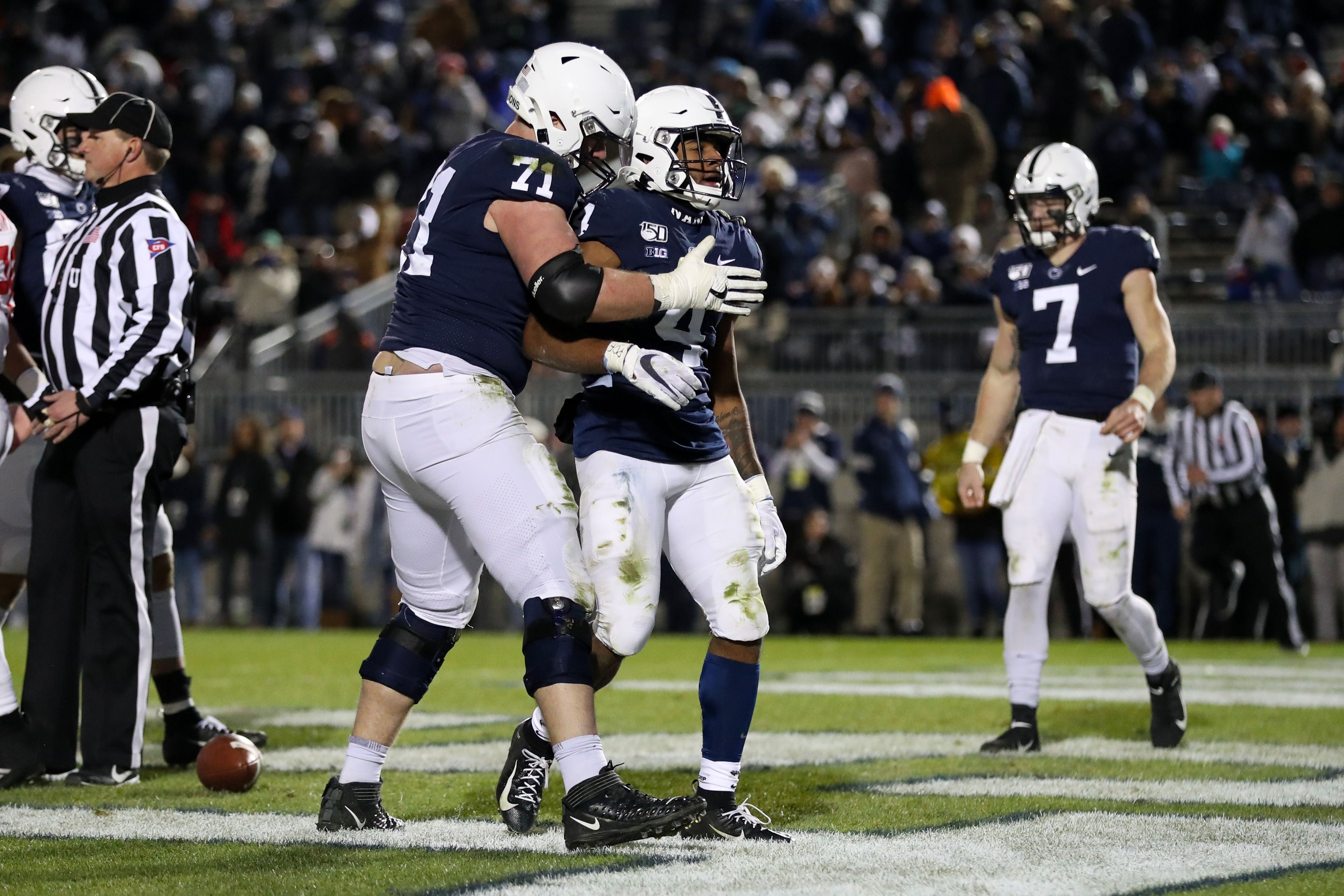 Penn State Nittany Lions running back Journey Brown (4) is congratulated by offensive linesman Will Fries (71) after scoring a touchdown during the fourth quarter against the Rutgers Scarlet Knights at Beaver Stadium. Penn State defeated Rutgers 27-6.
