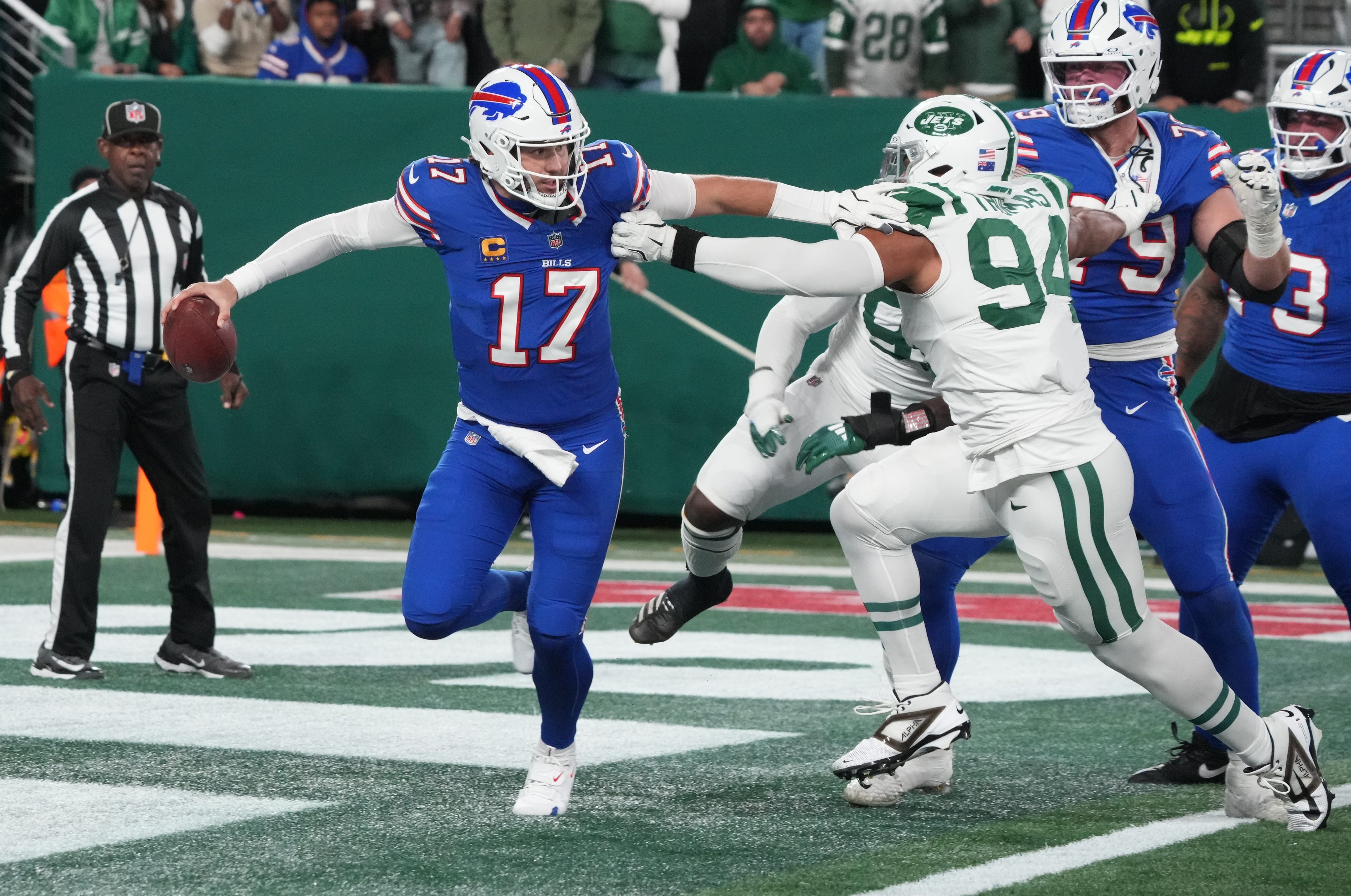Josh Allen of Buffalo gets out of the grasp of Solomon Thomas of the Jets in the first half. The Buffalo Bills came to MetLife Stadium to play the NY Jets. The Jets played their first game under new interim head coach Jeff Ulbrich.