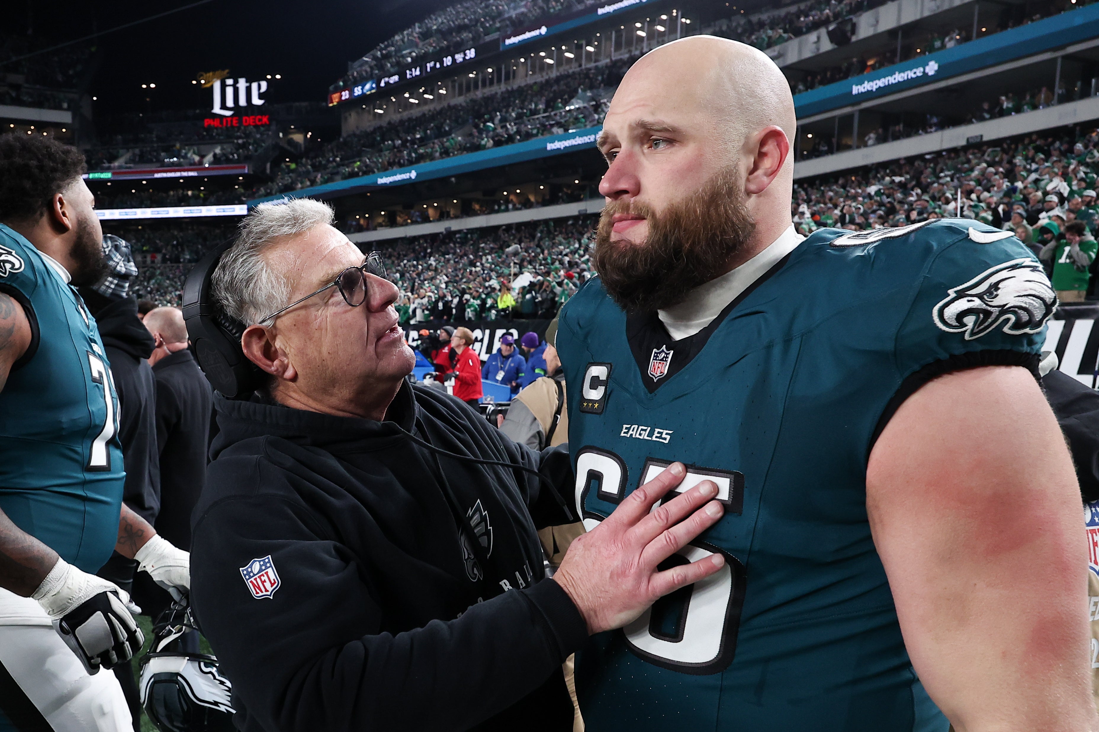 Philadelphia Eagles assistant coach Jeff Stoutland (L) and offensive tackle Lane Johnson (65) in the final minute of a victory in the NFC Championship game against the Washington Commanders at Lincoln Financial Field.