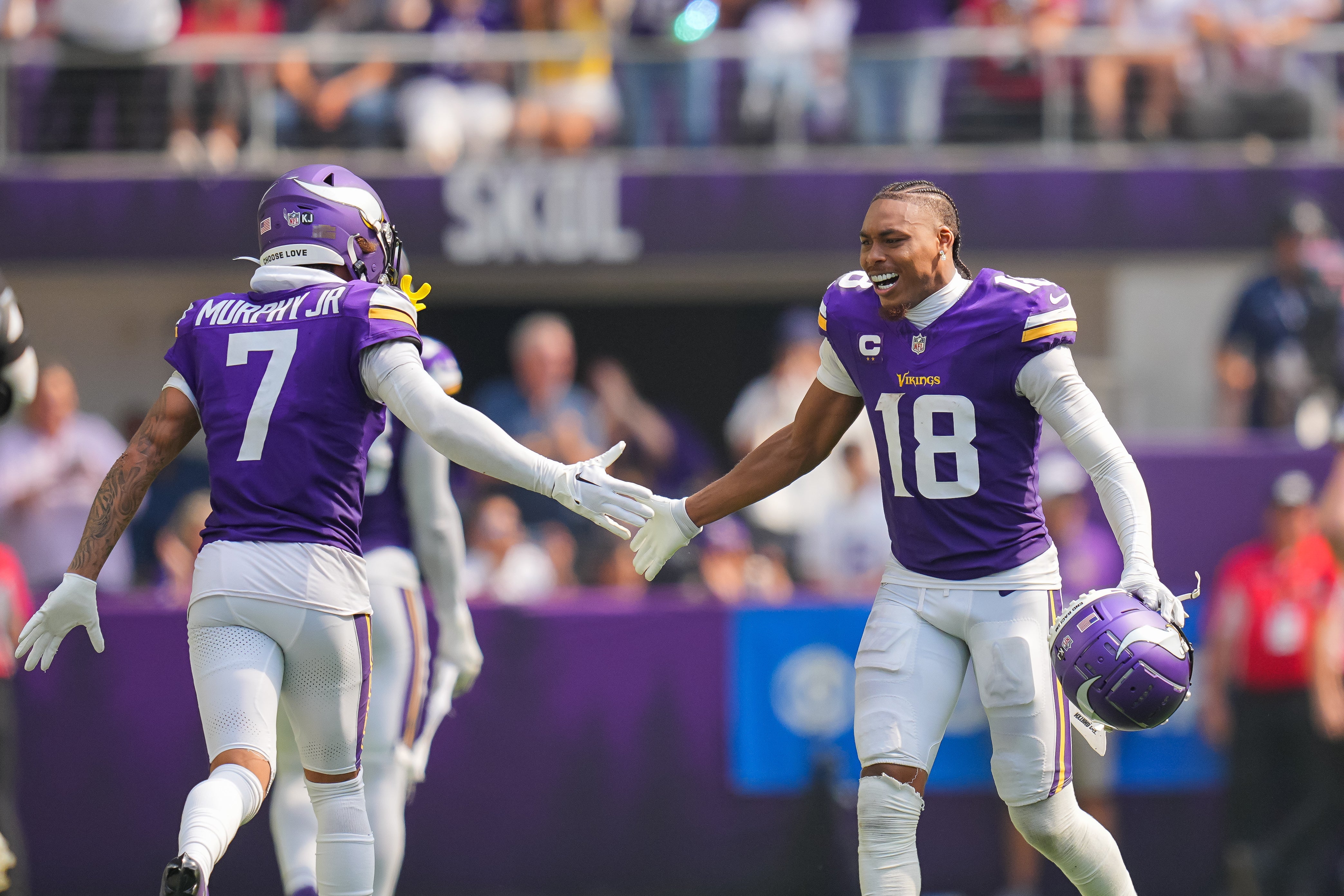 Sep 15, 2024; Minneapolis, Minnesota, USA; Minnesota Vikings wide receiver Justin Jefferson (18) celebrates an interception with cornerback Byron Murphy Jr. (7) against the San Francisco 49ers in the third quarter at U.S. Bank Stadium.