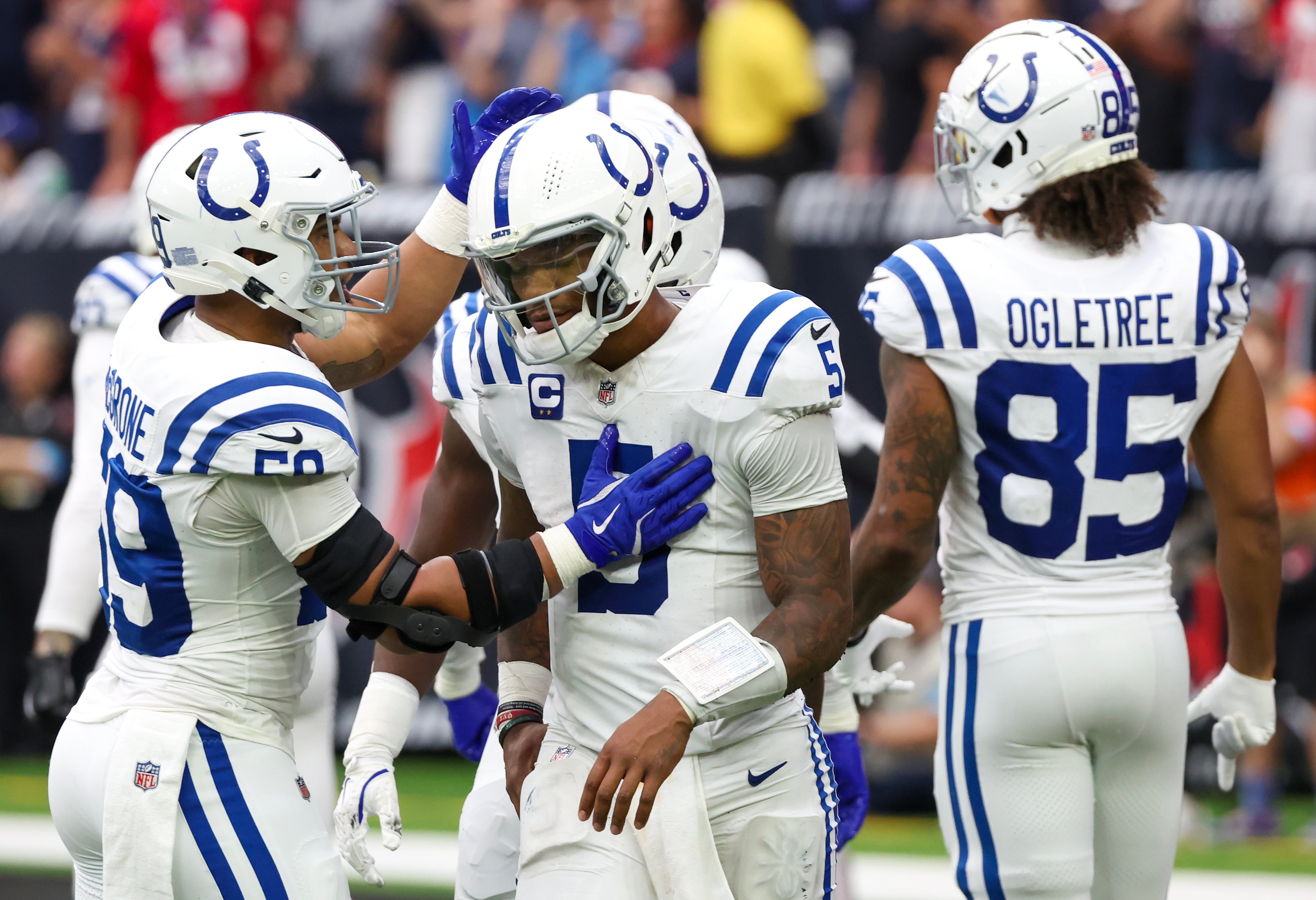 Oct 27, 2024; Houston, Texas, USA; Indianapolis Colts quarterback Anthony Richardson (5) is consulted by linebacker Cameron McGrone (59) after being sacked by the Houston Texans in the second half at NRG Stadium.