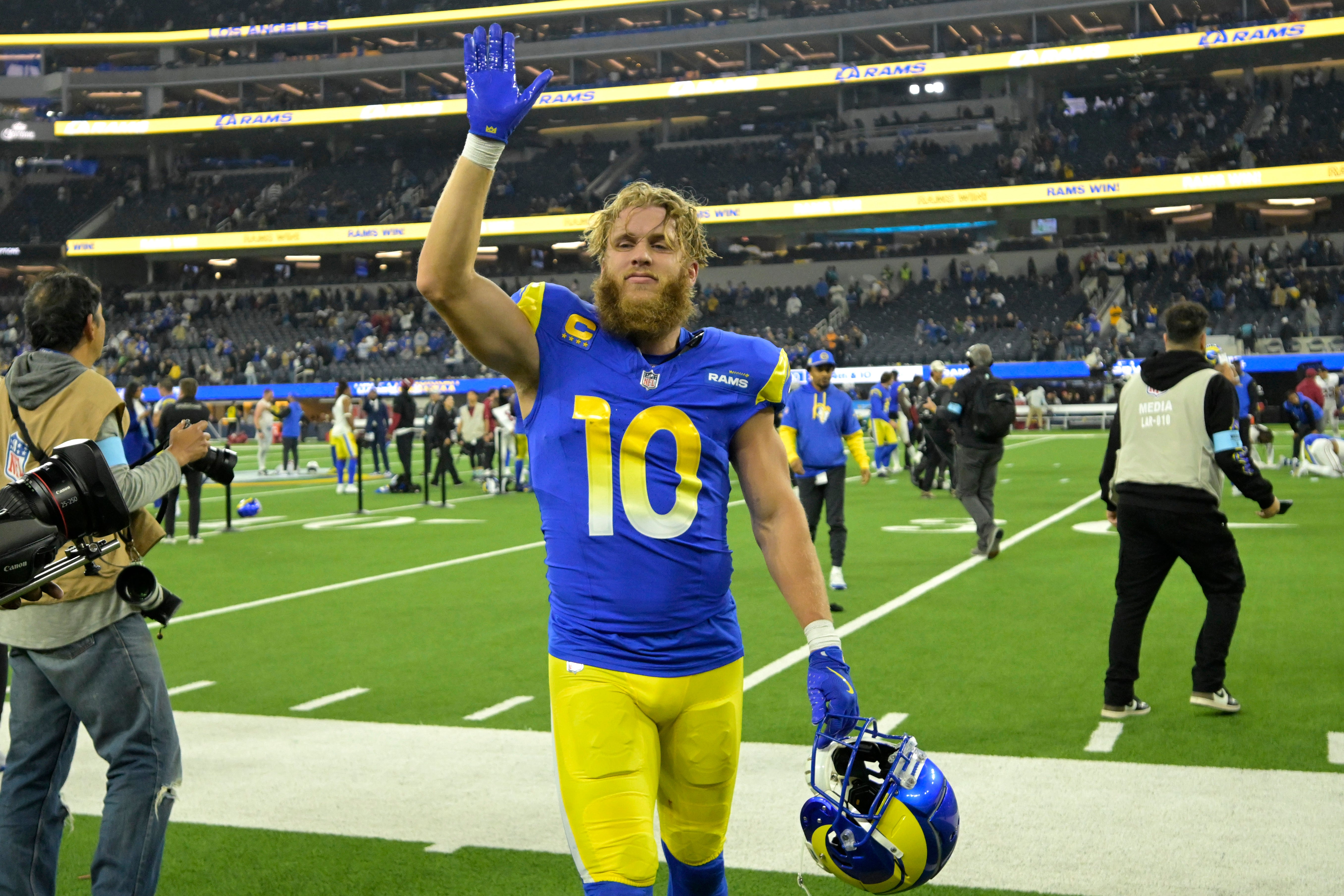 Dec 28, 2024; Inglewood, California, USA; Los Angeles Rams wide receiver Cooper Kupp (10) waves to fans as he leaves the field after defeating the Arizona Cardinals at SoFi Stadium.