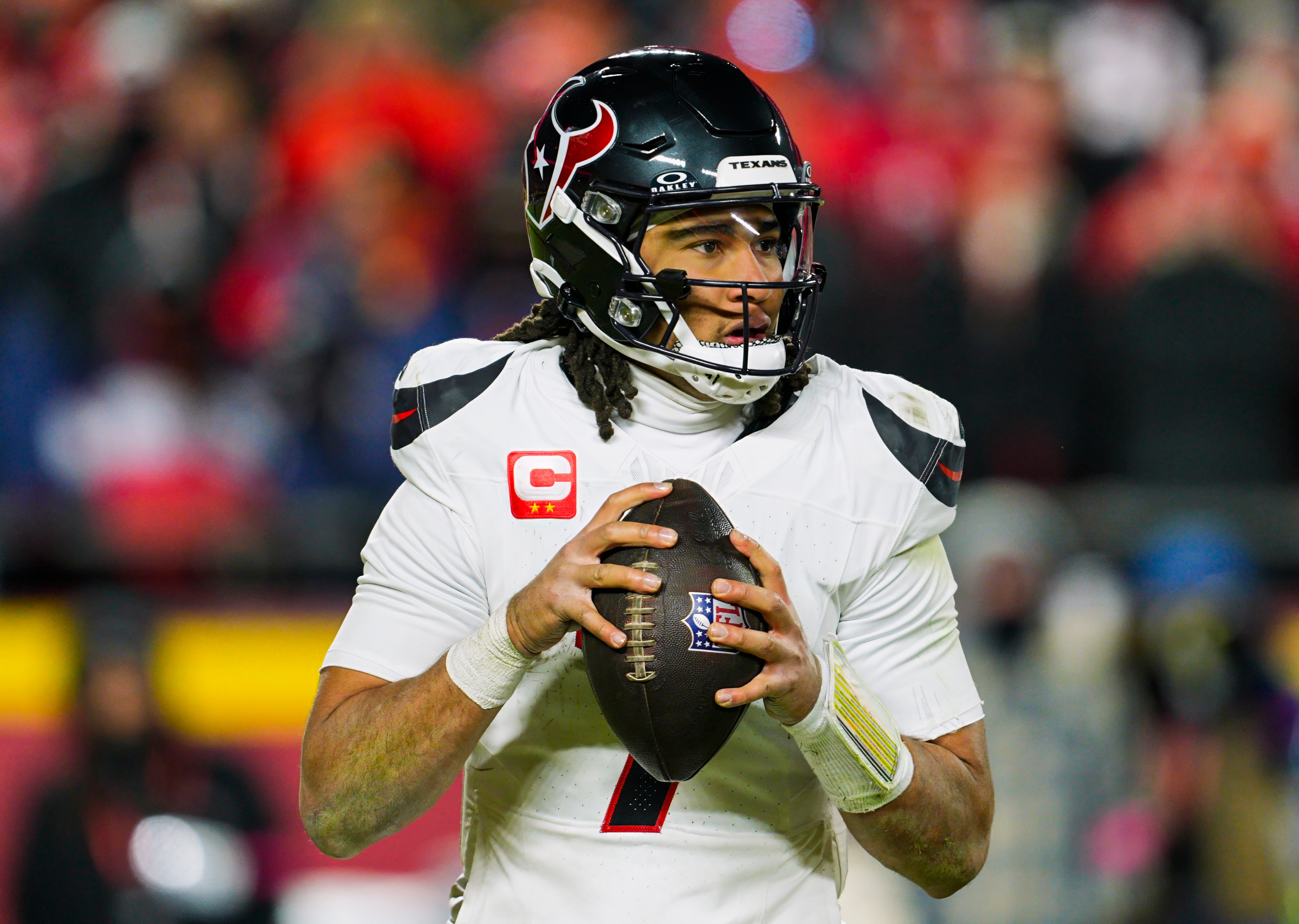 Houston Texans quarterback C.J. Stroud (7) drops back to pass during the second half against the Kansas City Chiefs in a 2025 AFC divisional round game at GEHA Field at Arrowhead Stadium.