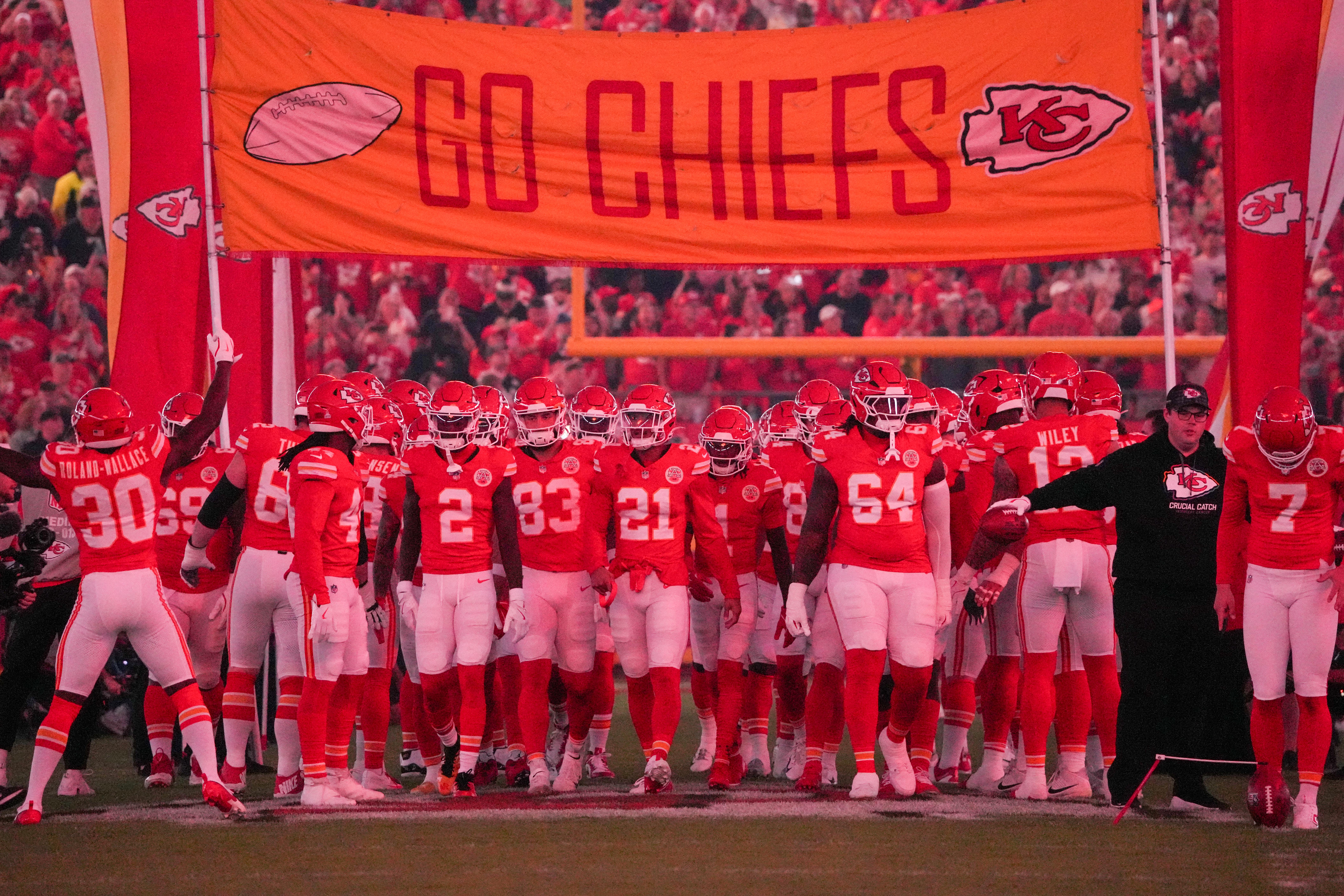 Oct 7, 2024; Kansas City, Missouri, USA; Kansas City Chiefs players are introduced on field under red lights prior to a game against the New Orleans Saints at GEHA Field at Arrowhead Stadium.