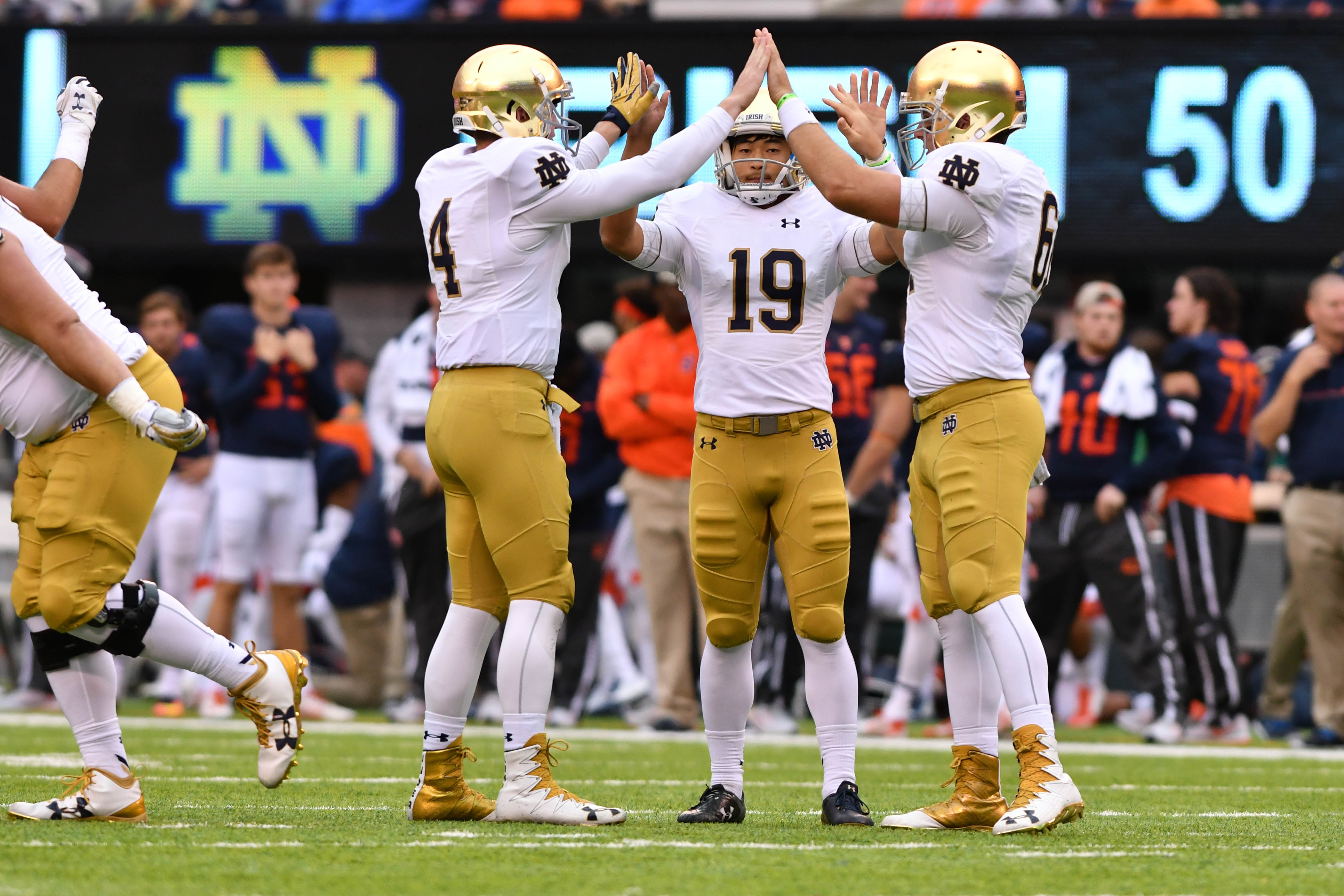 Notre Dame Fighting Irish holder Montgomery VanGorder (4) kicker Justin Yoon (19) and long snapper Scott Daly (61) celebrate after a field goal in the fourth quarter agains the Syracuse Orange at MetLife Stadium. Notre Dame won 50-33. 
