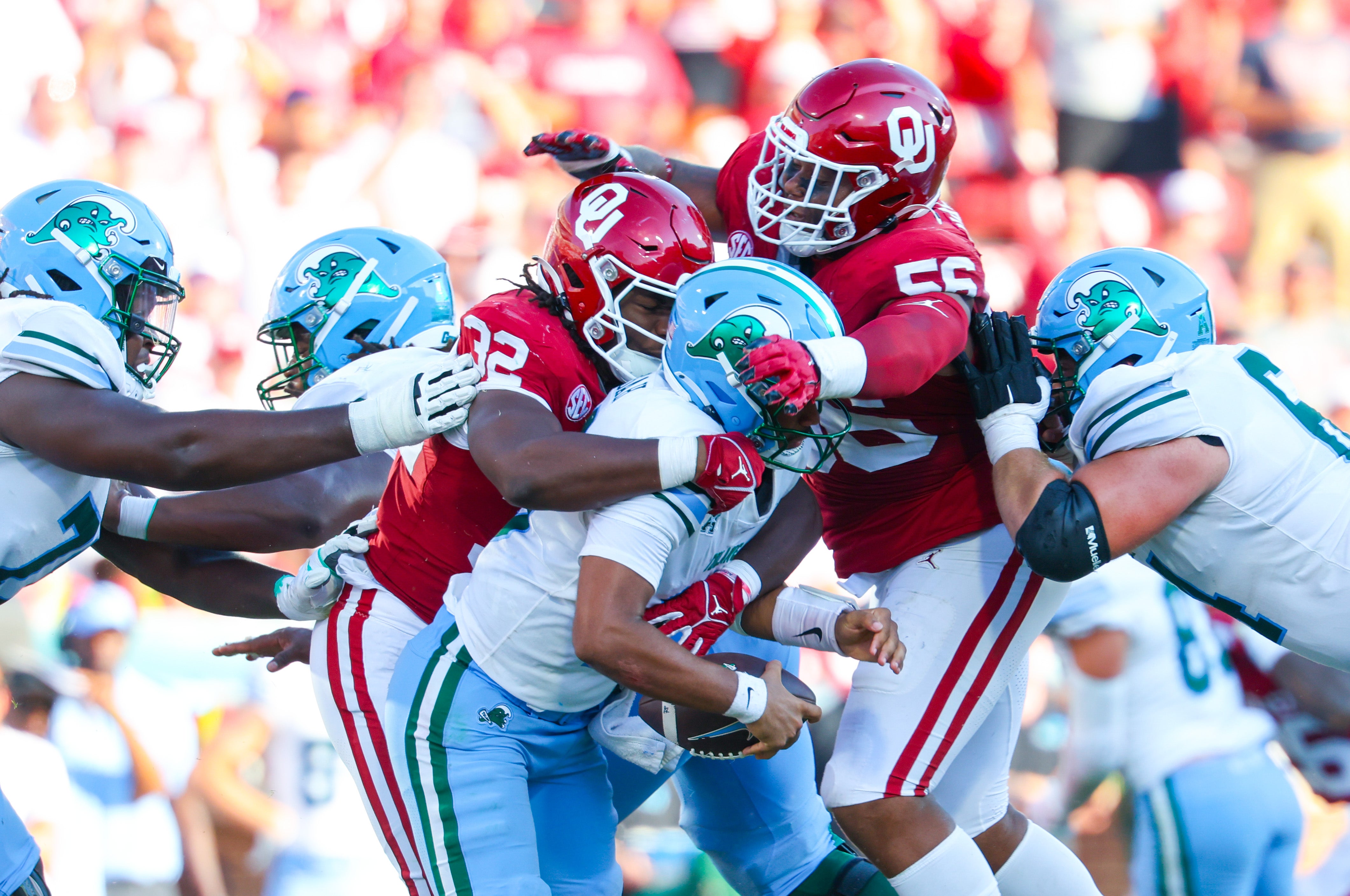 Sep 14, 2024; Norman, Oklahoma, USA; Oklahoma Sooners defensive lineman R Mason Thomas (32) and Oklahoma Sooners defensive lineman Gracen Halton (56) sack Tulane Green Wave quarterback Darian Mensah (10) during the second half at Gaylord Family-Oklahoma Memorial Stadium.