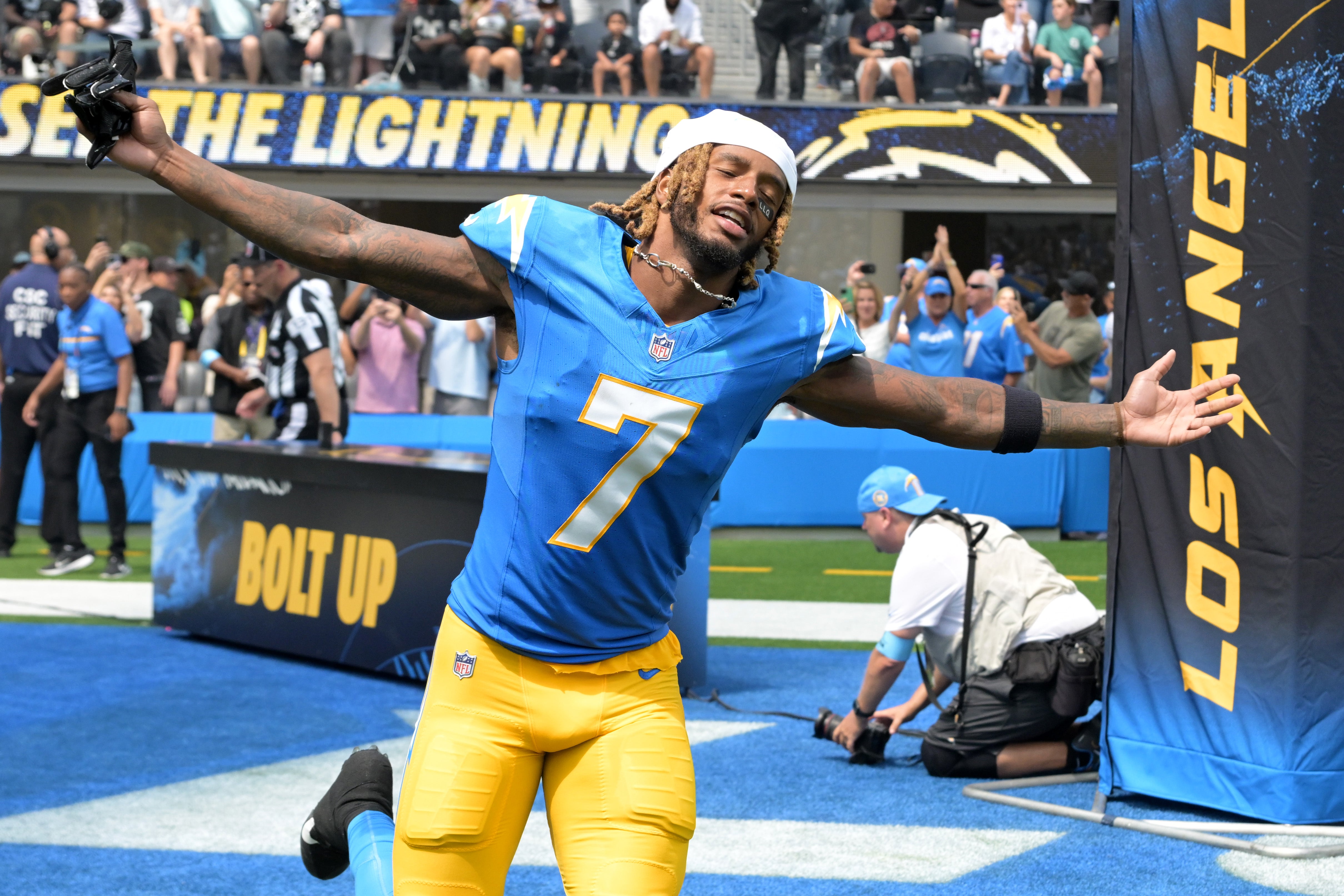 Sep 8, 2024; Inglewood, California, USA; Los Angeles Chargers cornerback Kristian Fulton (7) runs on to the field for the game against the Las Vegas Raiders at SoFi Stadium.