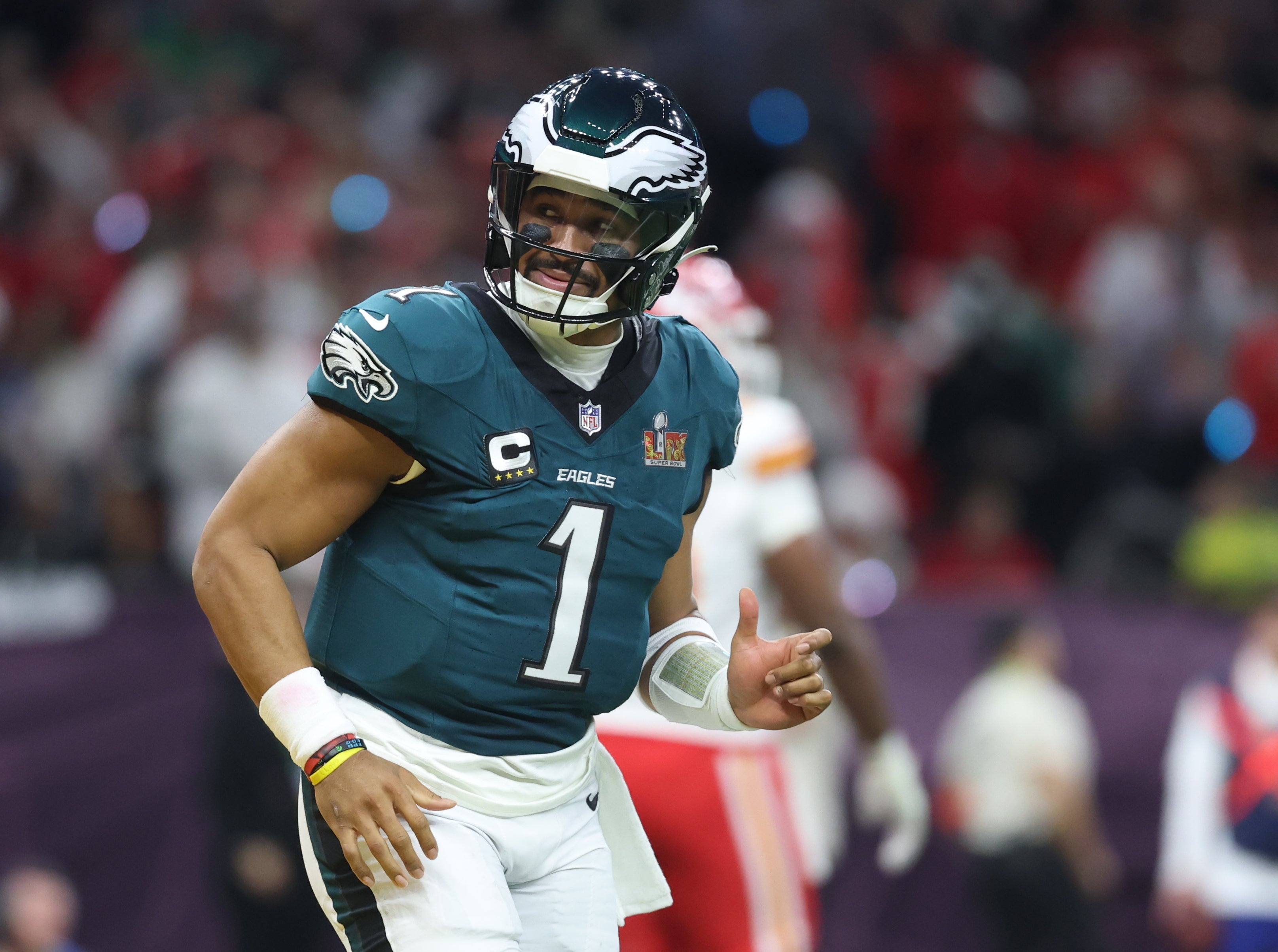 Philadelphia Eagles quarterback Jalen Hurts (1) reacts after scoring a touchdown against the Kansas City Chiefs in the first quarter in Super Bowl LIX at Ceasars Superdome.
