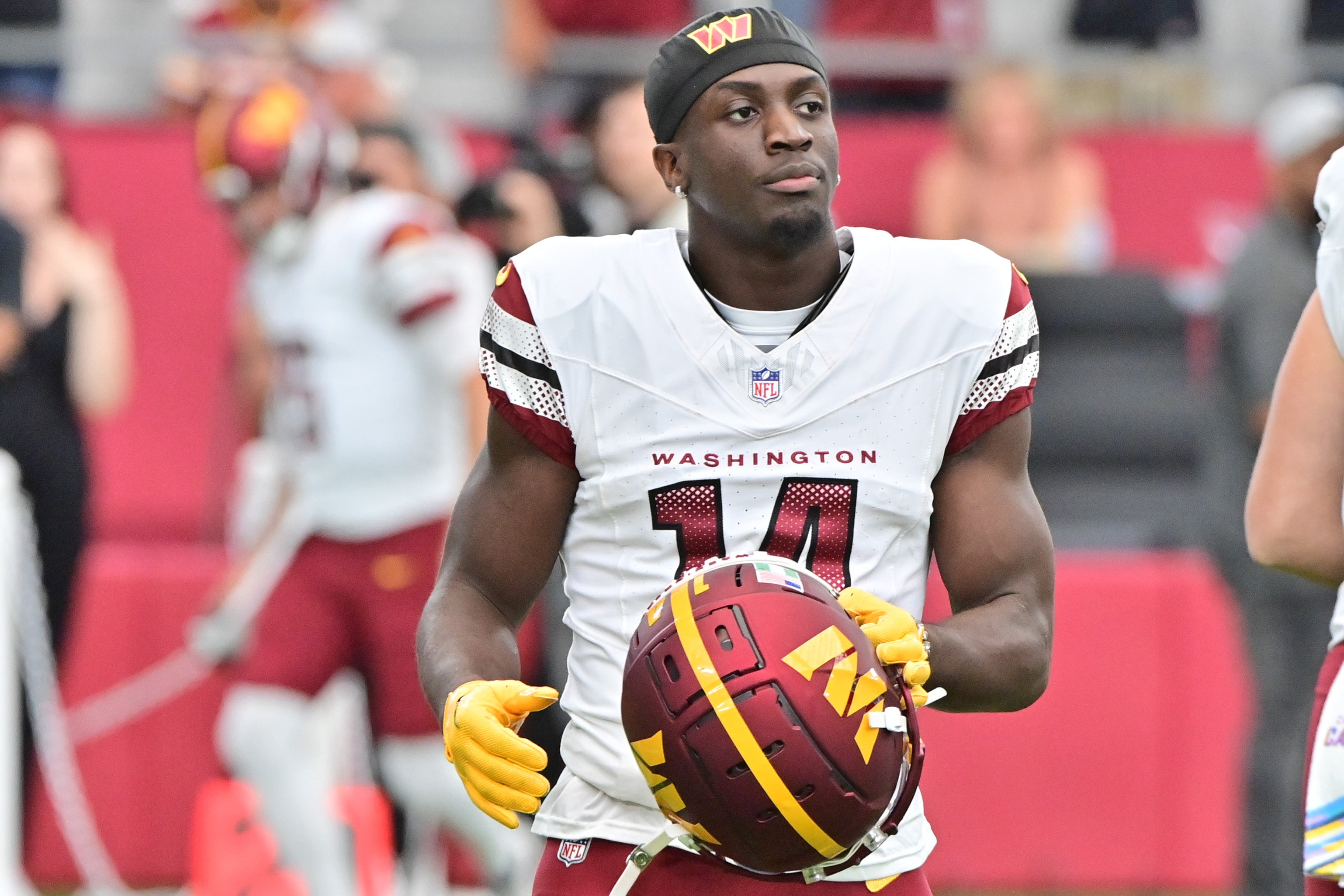Sep 29, 2024; Glendale, Arizona, USA; Washington Commanders wide receiver Olamide Zaccheaus (14) looks on prior to the game against the Arizona Cardinals at State Farm Stadium.
