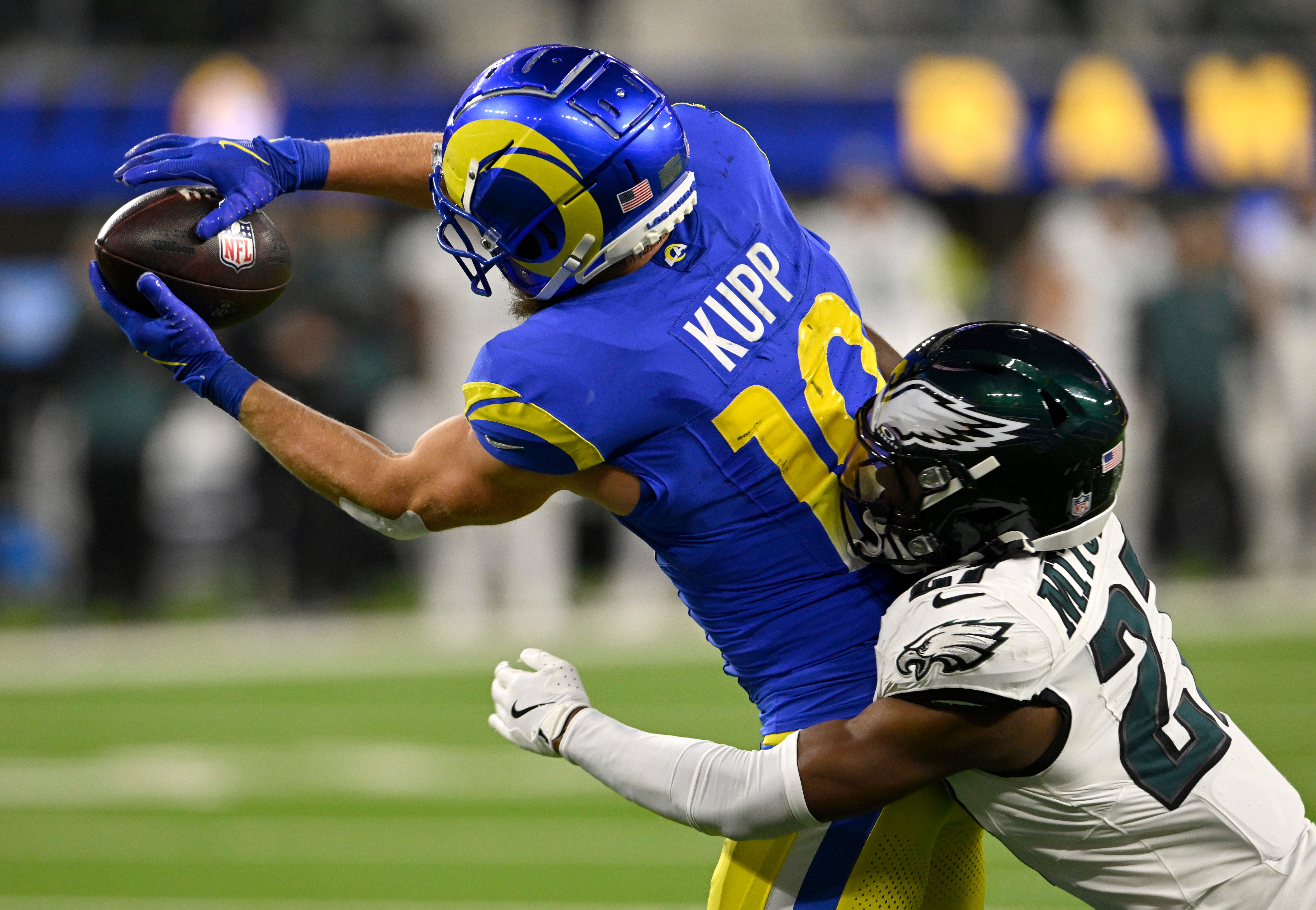 ov 24, 2024; Inglewood, California, USA; Los Angeles Rams wide receiver Cooper Kupp (10) catches a touchdown pass against Philadelphia Eagles cornerback Quinyon Mitchell (27) during the second half at SoFi Stadium.