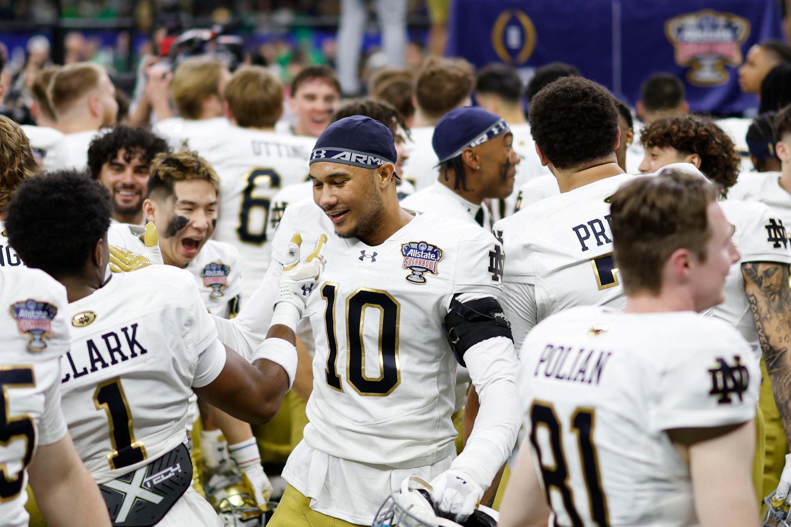 Notre Dame Fighting Irish defensive lineman Loghan Thomas (10) and Fighting Irish safety Jordan Clark (1) celebrate after their game against the Georgia Bulldogs at Caesars Superdome.
