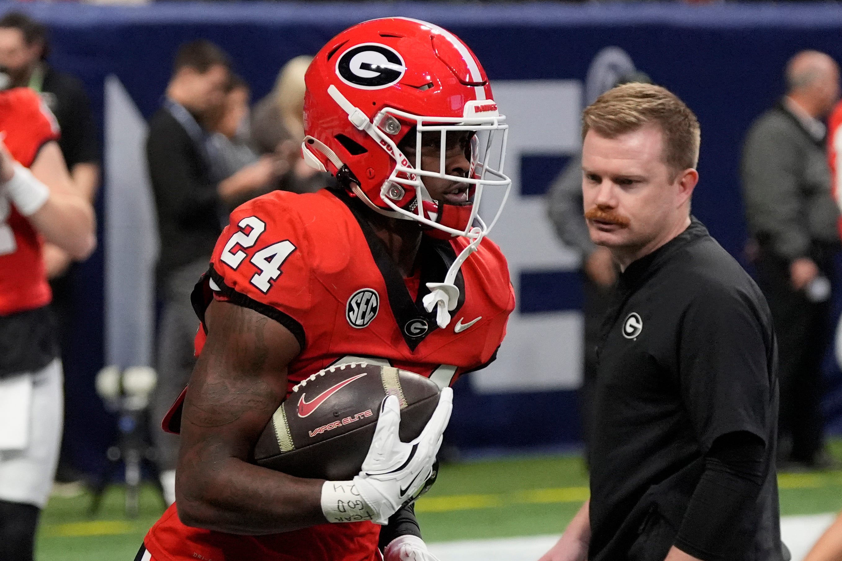 Georgia defensive back Malaki Starks (24) warms up before the start of the SEC championship game against Texas in Atlanta, on Saturday, Dec. 7, 2024.