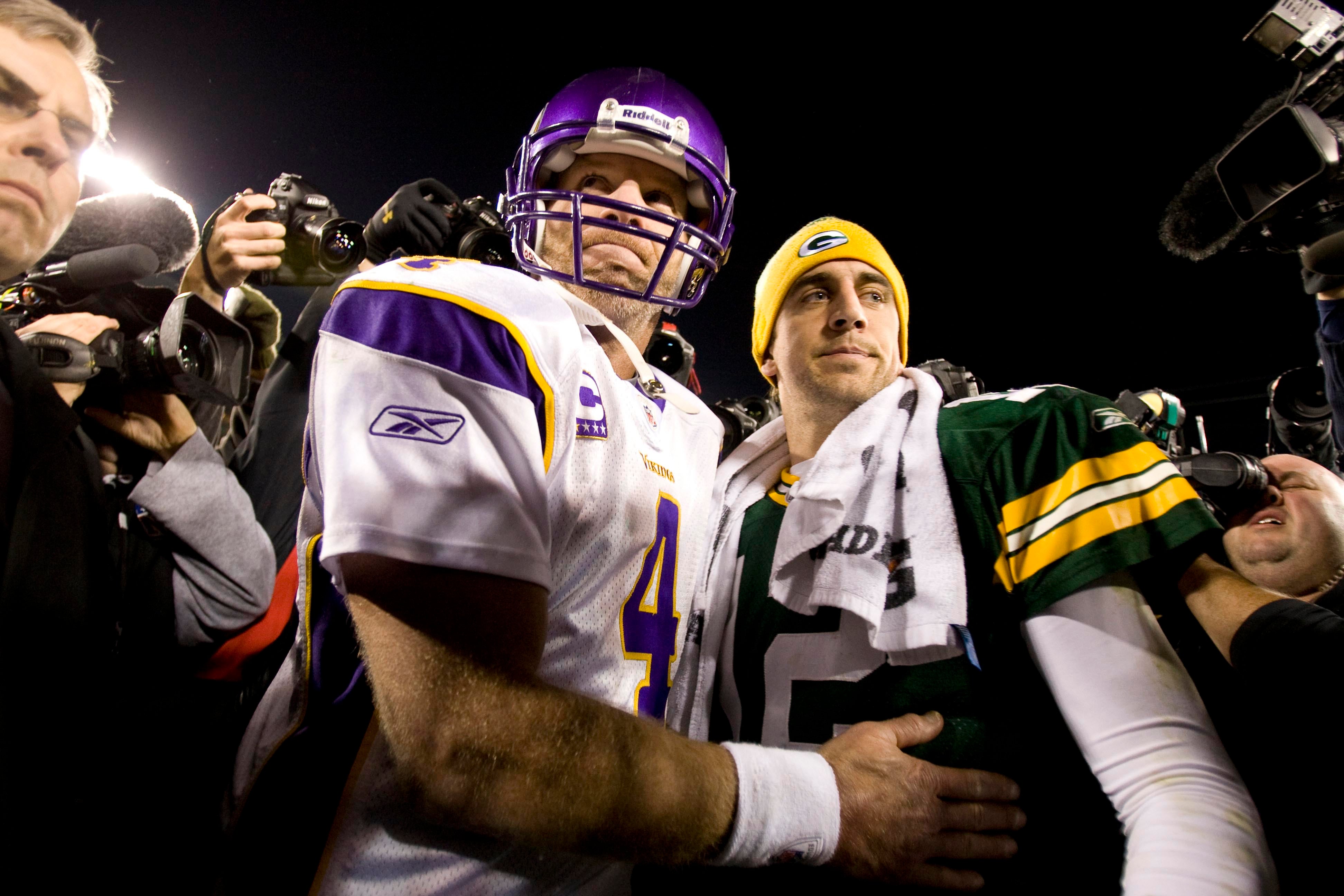Nov 1, 2009; Green Bay, WI, USA; Minnesota Vikings quarterback Brett Favre (4) greets Green Bay Packers quarterback Aaron Rodgers (12) following the game at Lambeau Field. The Vikings defeated the Packers 38-26.