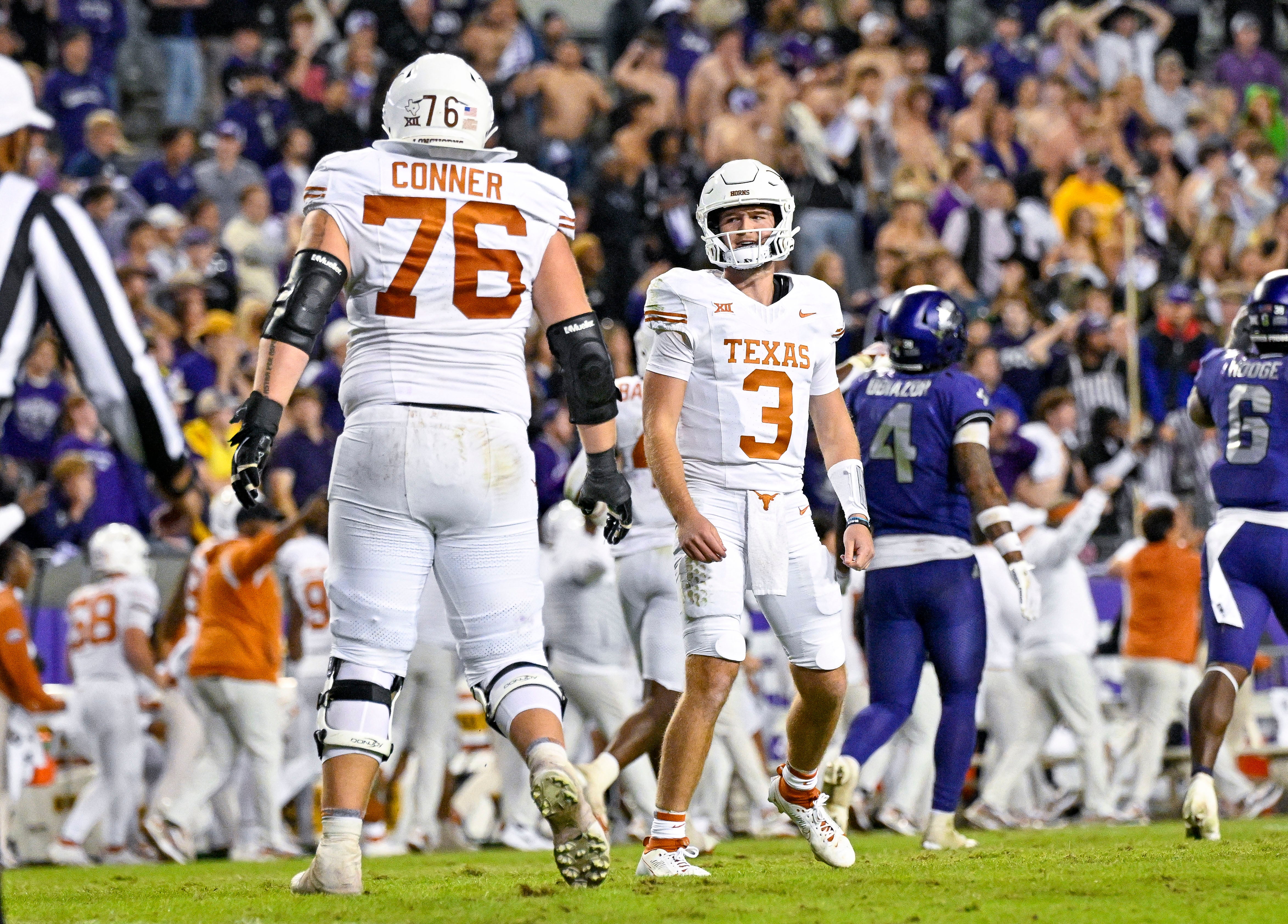 Nov 11, 2023; Fort Worth, Texas, USA; Texas Longhorns offensive lineman Hayden Conner (76) and quarterback Quinn Ewers (3) celebrate after Ewers completes a pass for a first down to seal the win against the TCU Horned Frogs during the second half at Amon G. Carter Stadium.