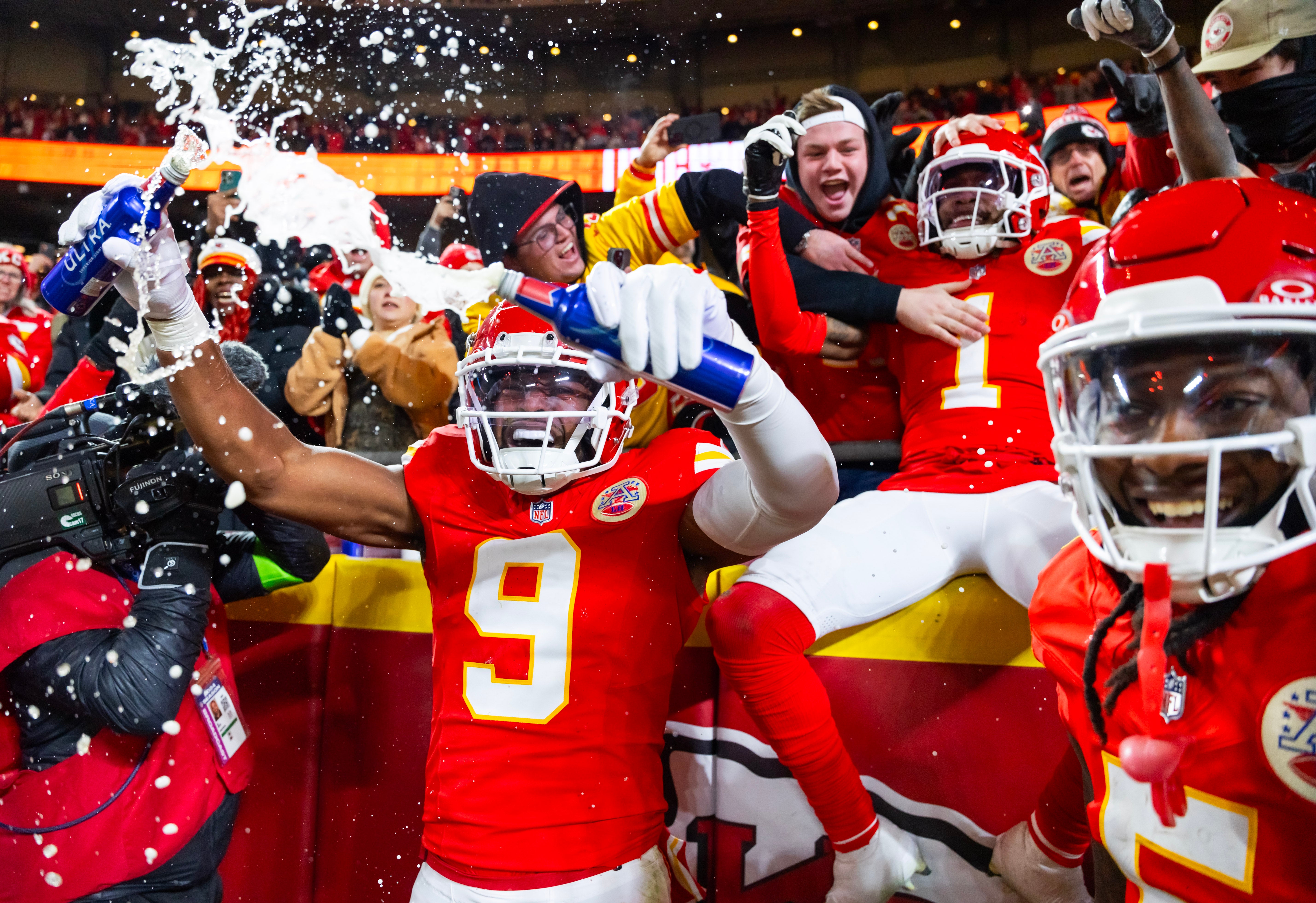 Jan 26, 2025; Kansas City, MO, USA; Kansas City Chiefs wide receiver Xavier Worthy (1) and wide receiver JuJu Smith-Schuster (9) celebrate with fans after a touchdown against the Buffalo Bills during the first half in the AFC Championship game at GEHA Field at Arrowhead Stadium.