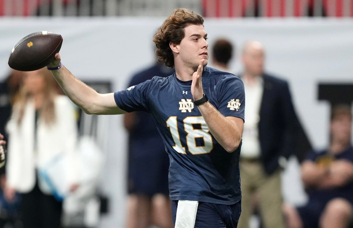 Notre Dame Fighting Irish quarterback Steve Angeli (18) throws the ball during practice at Mercedes-Benz Stadium.