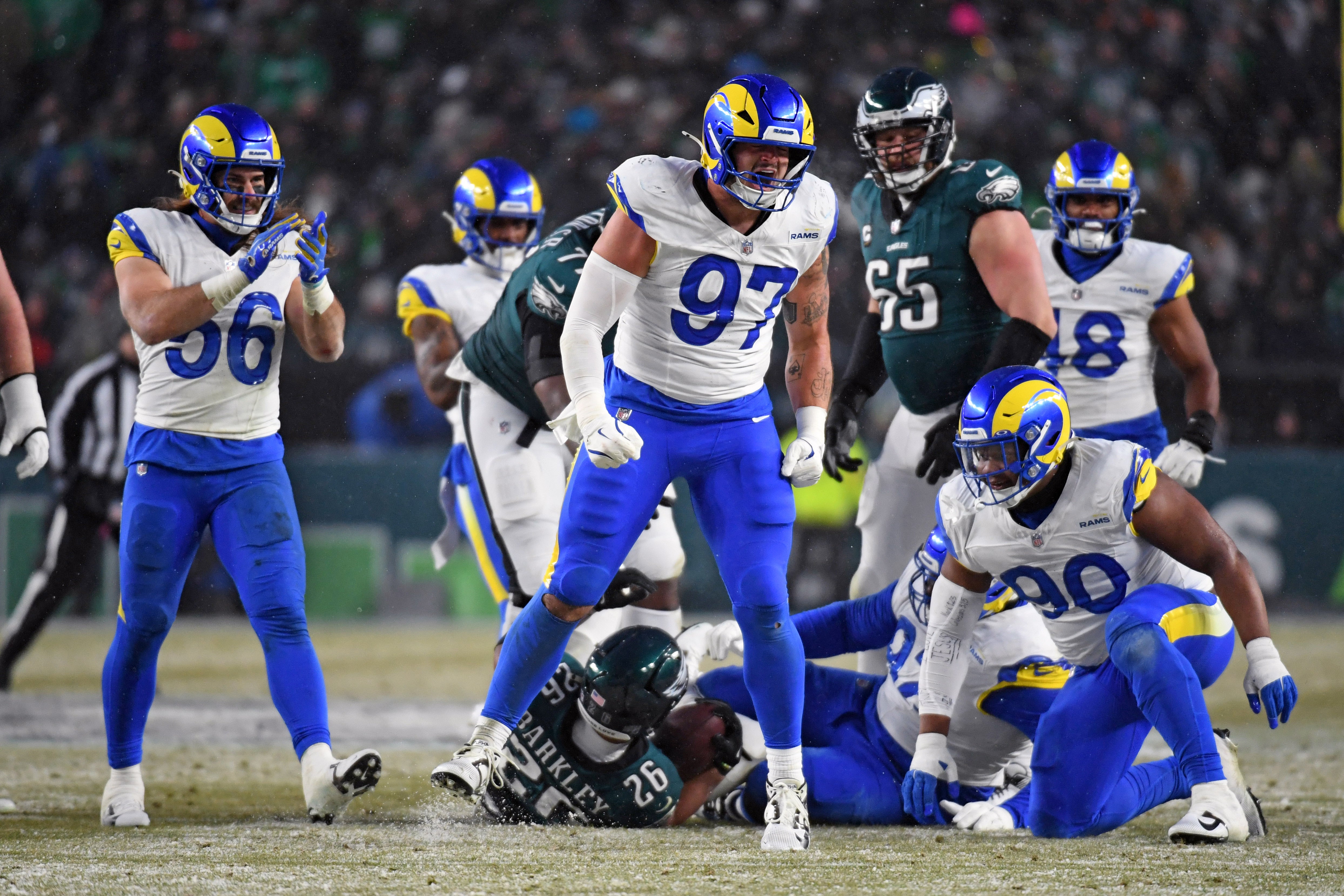Jan 19, 2025; Philadelphia, Pennsylvania, USA; Los Angeles Rams linebacker Michael Hoecht (97) reacts after making a tackle against the Philadelphia Eagles in a 2025 NFC divisional round game at Lincoln Financial Field.