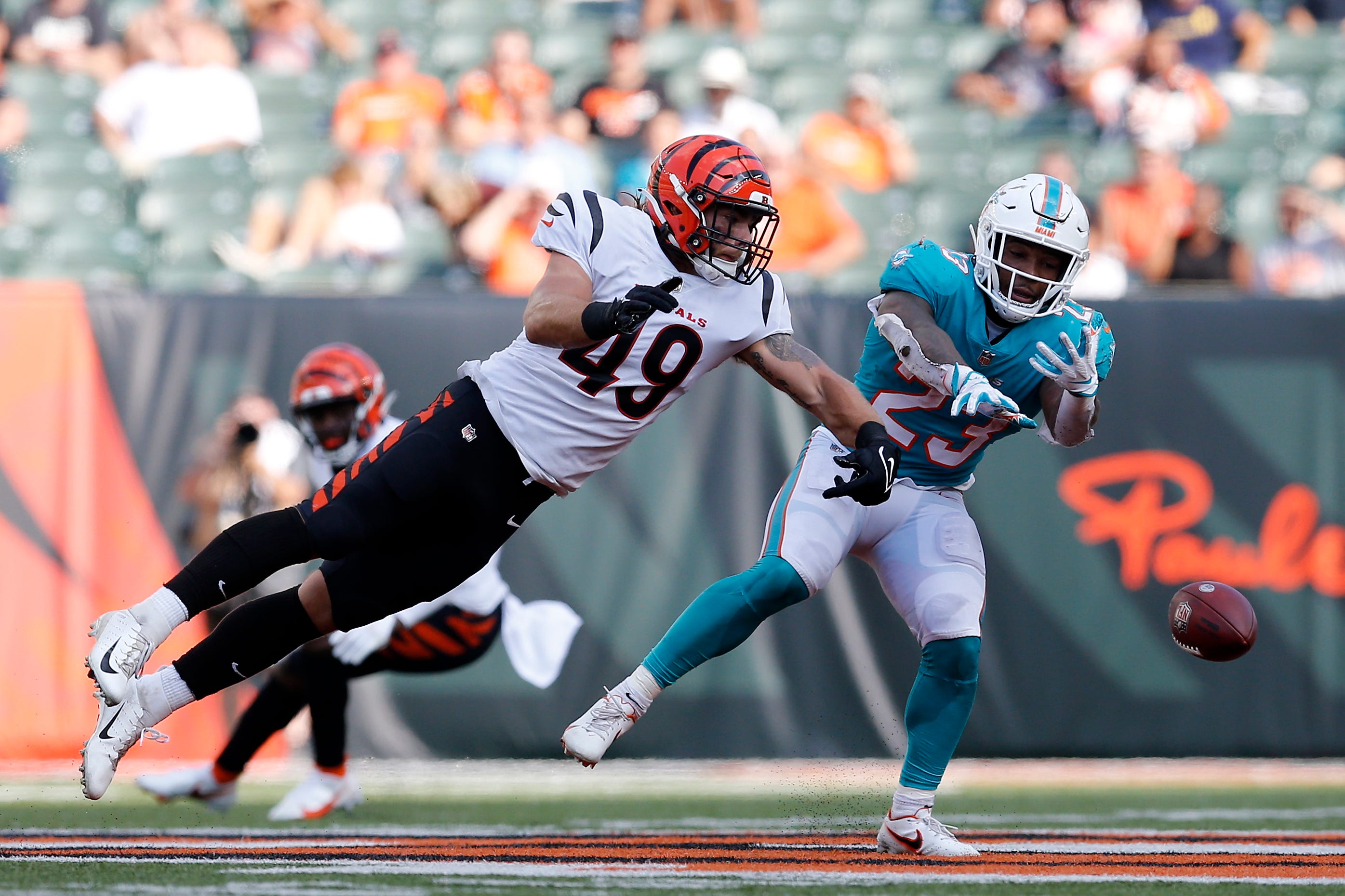 Cincinnati Bengals linebacker Joe Bachie (49) breaks up a pass intended for Miami Dolphins running back Gerrid Doaks (23) in the third quarter of the NFL Preseason Week 3 game between the Cincinnati Bengals and the Miami Dolphins at Paul Brown Stadium in downtown Cincinnati on Sunday, Aug. 29, 2021. The Dolphins made a long touchdown drive in the fourth quarter to win 29-26. Miami Dolphins At Cincinnati Bengals Preseason