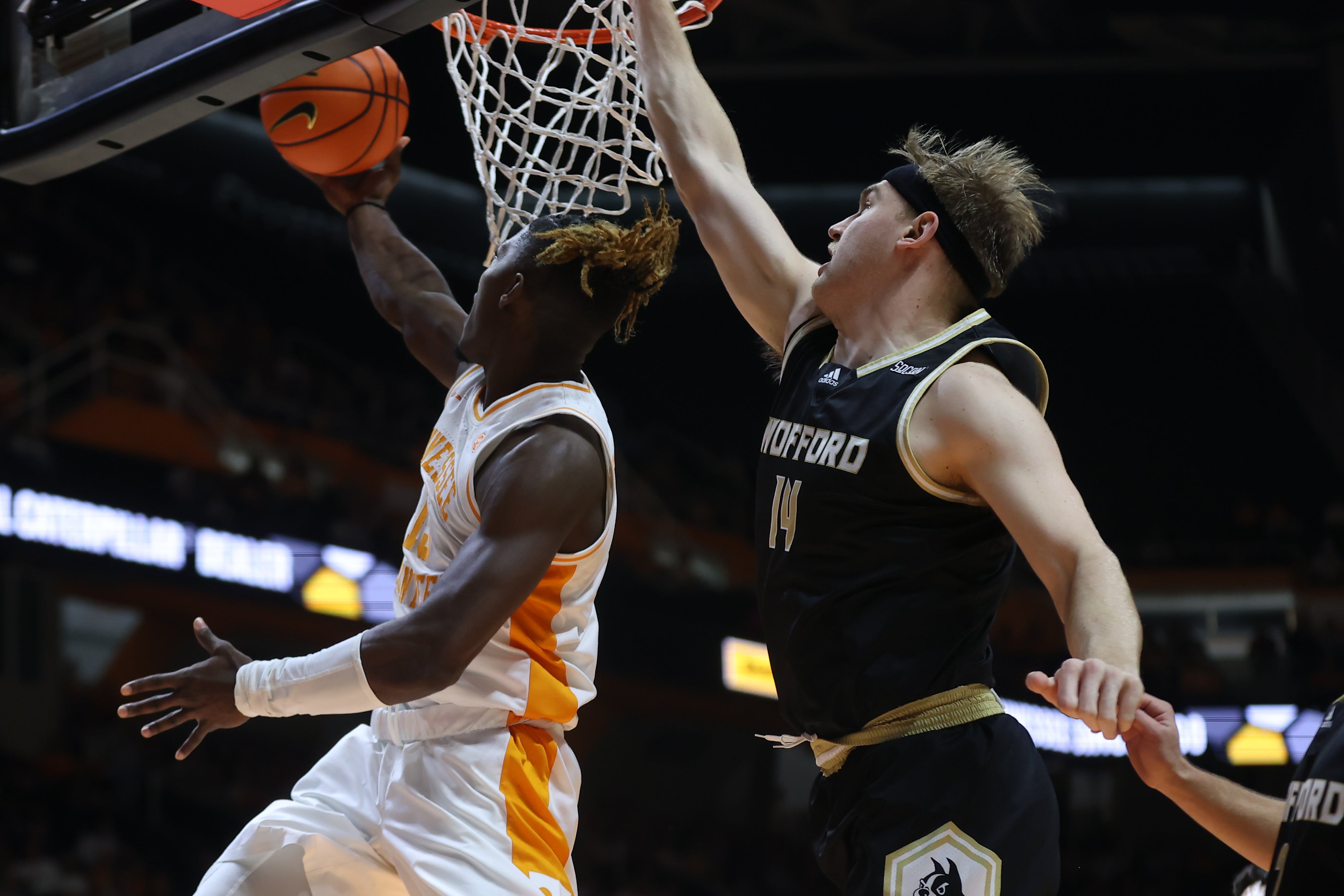 Nov 14, 2023; Knoxville, Tennessee, USA; Tennessee Volunteers guard Jahmai Mashack (15) lays the ball up against Wofford Terriers center Kyler Filewich (14) during the first half at Thompson-Boling Arena at Food City Center.