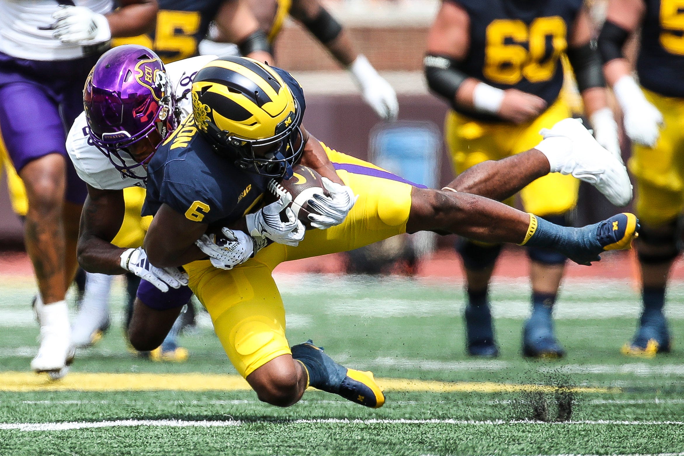 Michigan wide receiver Cornelius Johnson makes a catch against East Carolina defensive back Shavon Revel during the second half of U-M's 30-3 win on Saturday, Sept. 2, 2023, at Michigan Stadium.