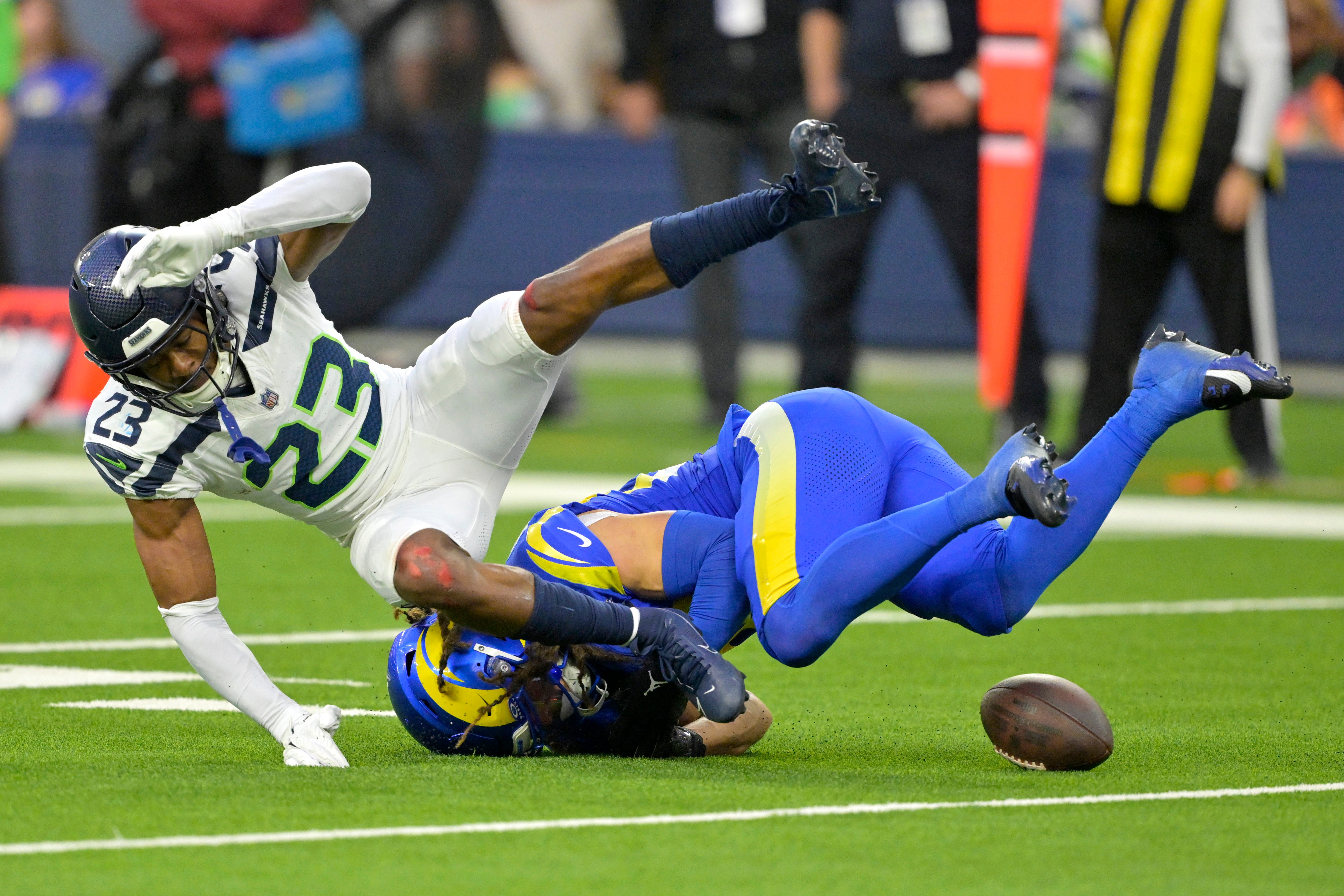Jan 5, 2025; Inglewood, California, USA; Seattle Seahawks cornerback Artie Burns (23) breaks up a pass for Los Angeles Rams wide receiver Jordan Whittington (88) in the final seconds of the game at SoFi Stadium.