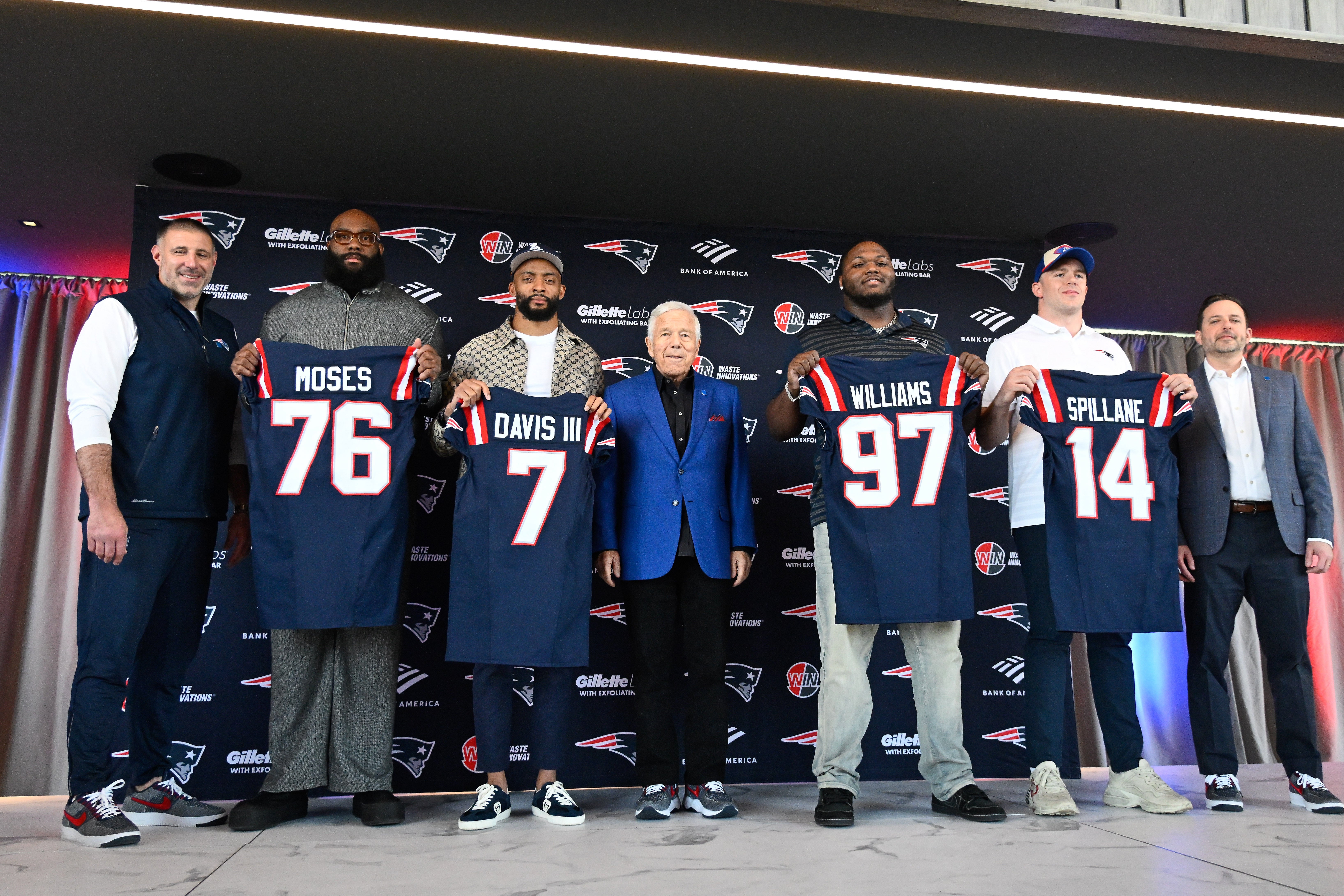 Mar 13, 2025; Foxborough, MA, USA; The New England Patriots hold a press conference at the GP Atrium at Gillette Stadium to introduce free agency additions to the team. (Left to right) New England Patriots head coach Mike Vrabel, offensive tackle Morgan Moses, cornerback Carlton Davis III, owner Robert Kraft, defensive tackle Milton Williams, linebacker Robert Spillane and executive vice president of player personnel Eliot Wolf.