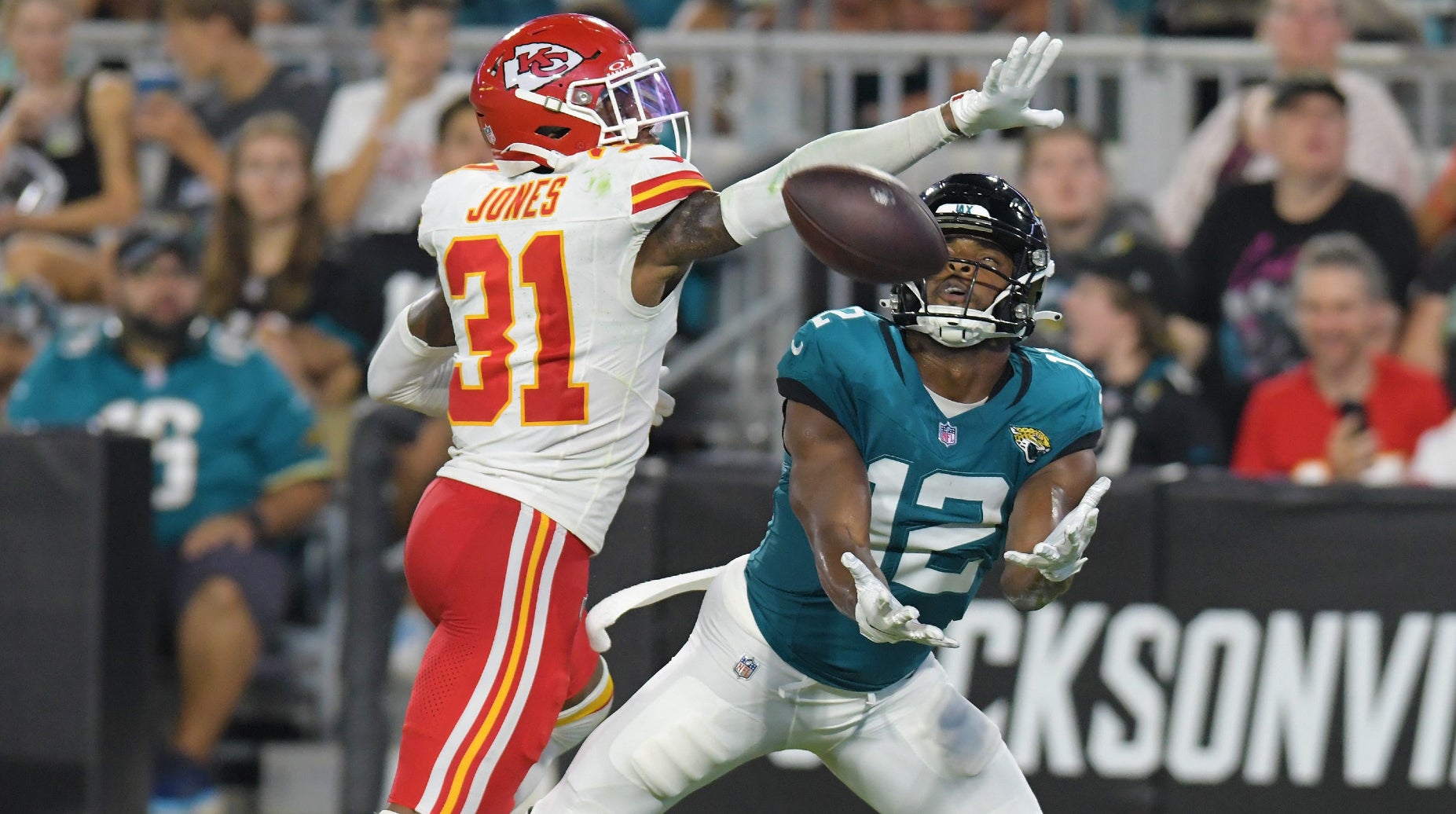 Jacksonville Jaguars wide receiver Devin Duvernay (12) pulls in a touchdown pass from Jacksonville Jaguars quarterback C.J. Beathard (3) late in the second quarter while being defended by Kansas City Chiefs cornerback Nic Jones (31). The Jaguars led 20 to 10 at the end of the first half. The Jacksonville Jaguars hosted the Kansas City Chiefs in the Jaguars first preseason game of the season Saturday, August10, 2024 at EverBank Stadium in Jacksonville, Fla.