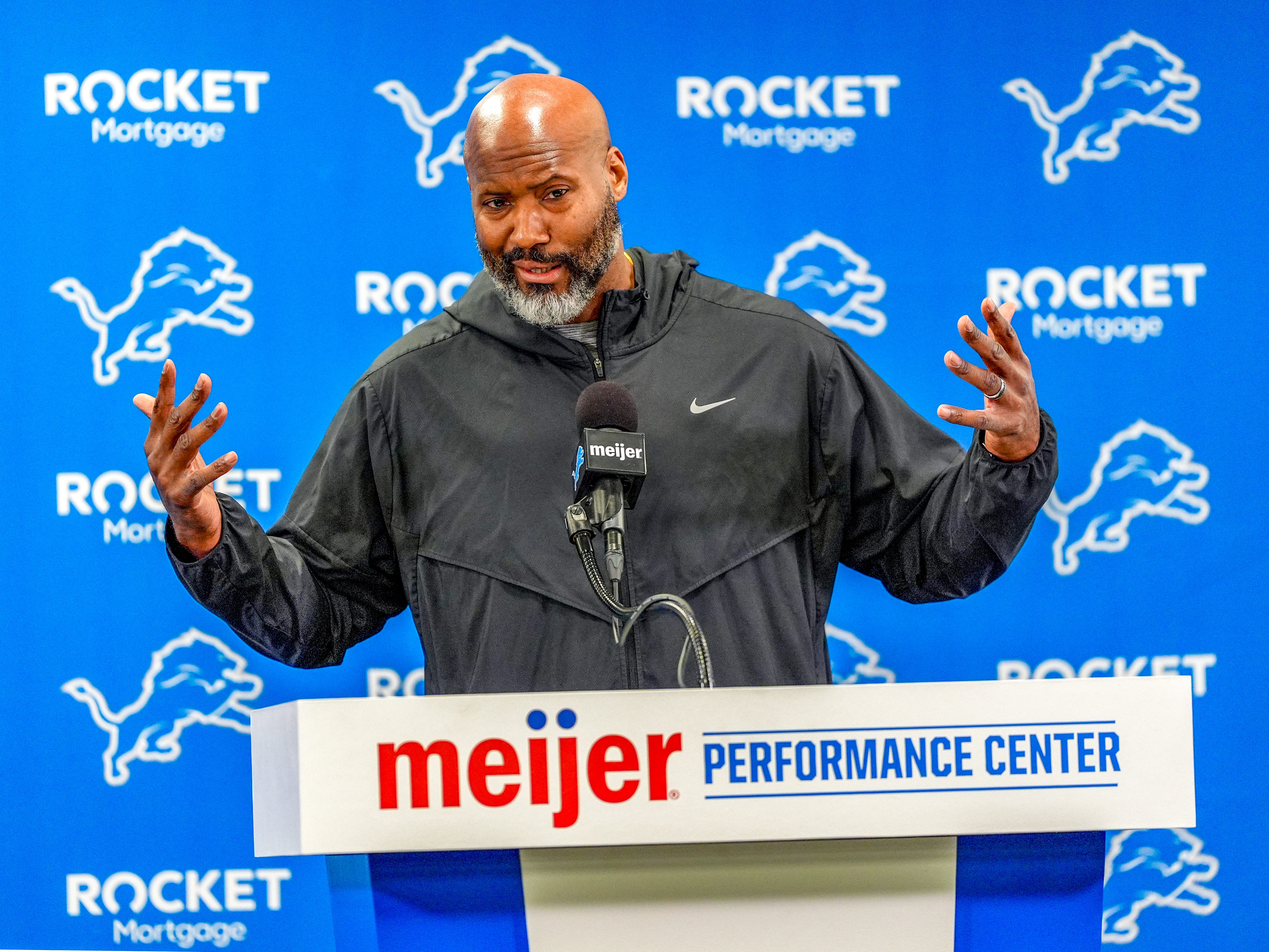 Brad Holmes speaks with reporters.