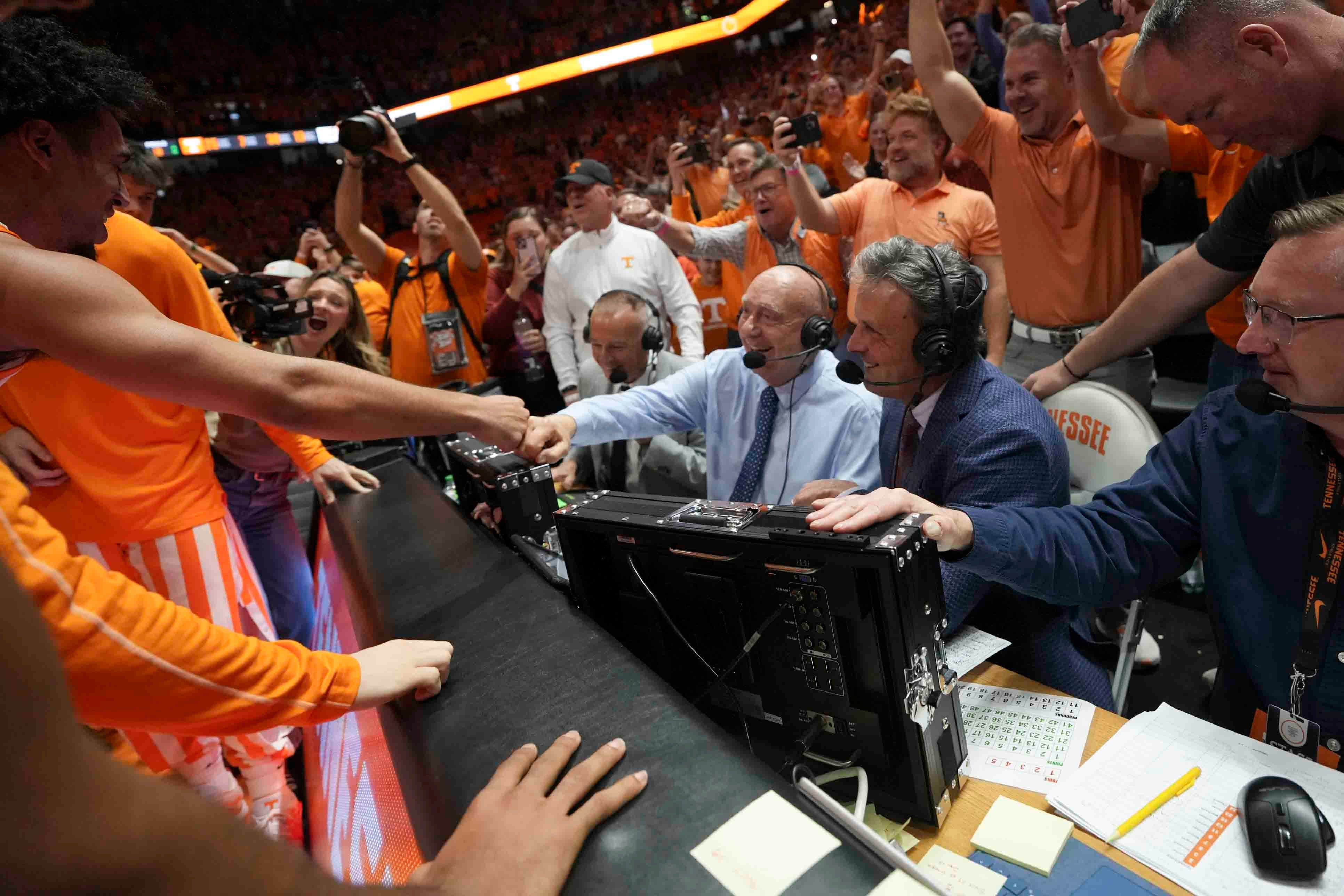 Tennessee players celebrate with Dick Vitale after a men’s college basketball game between Tennessee and Alabama at Thompson-Boling Arena at Food City Center, Saturday, March 1, 2025.