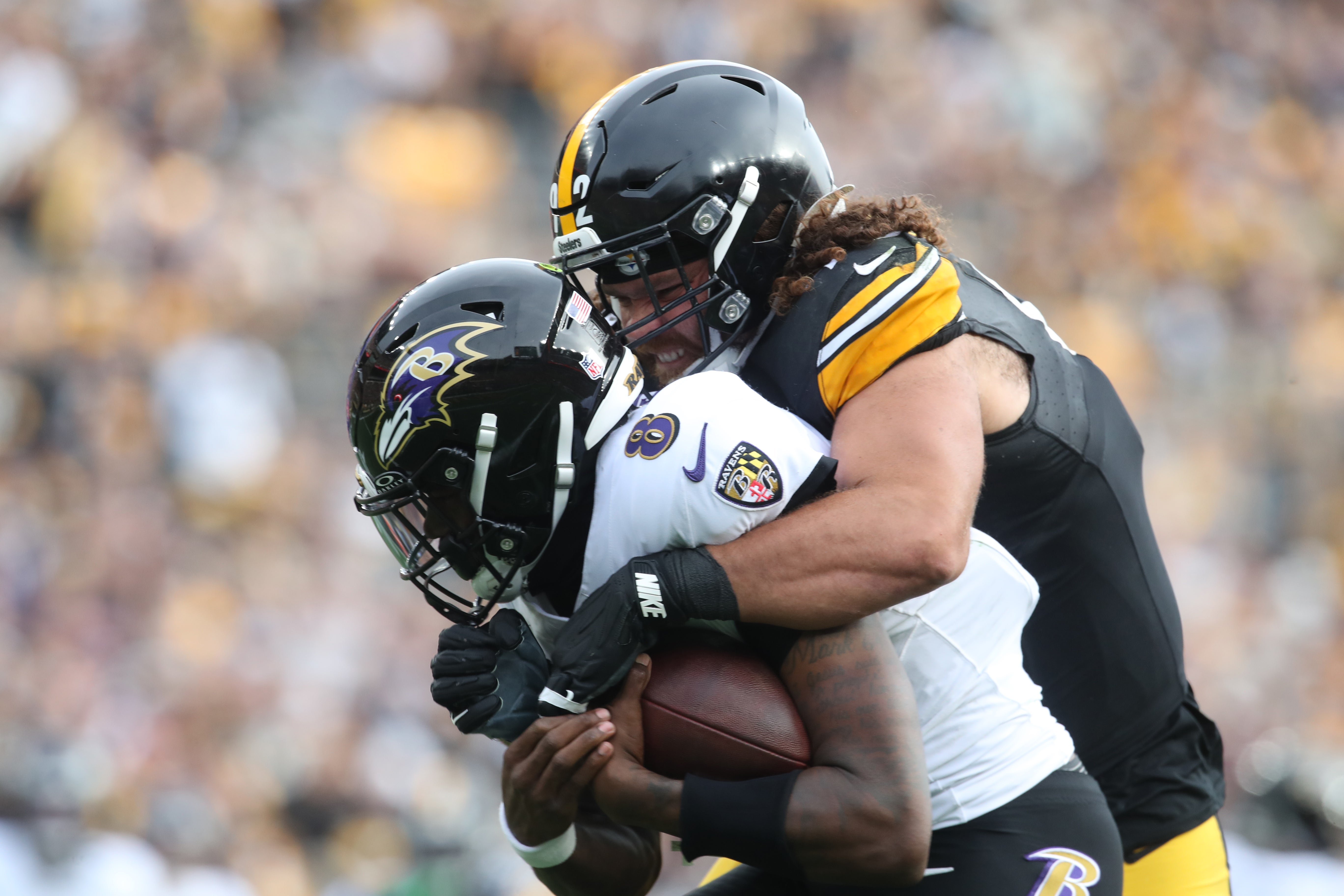 Nov 17, 2024; Pittsburgh, Pennsylvania, USA; Pittsburgh Steelers defensive tackle Isaiahh Loudermilk (92) raps up Baltimore Ravens quarterback Lamar Jackson (8) during the second quarter at Acrisure Stadium.