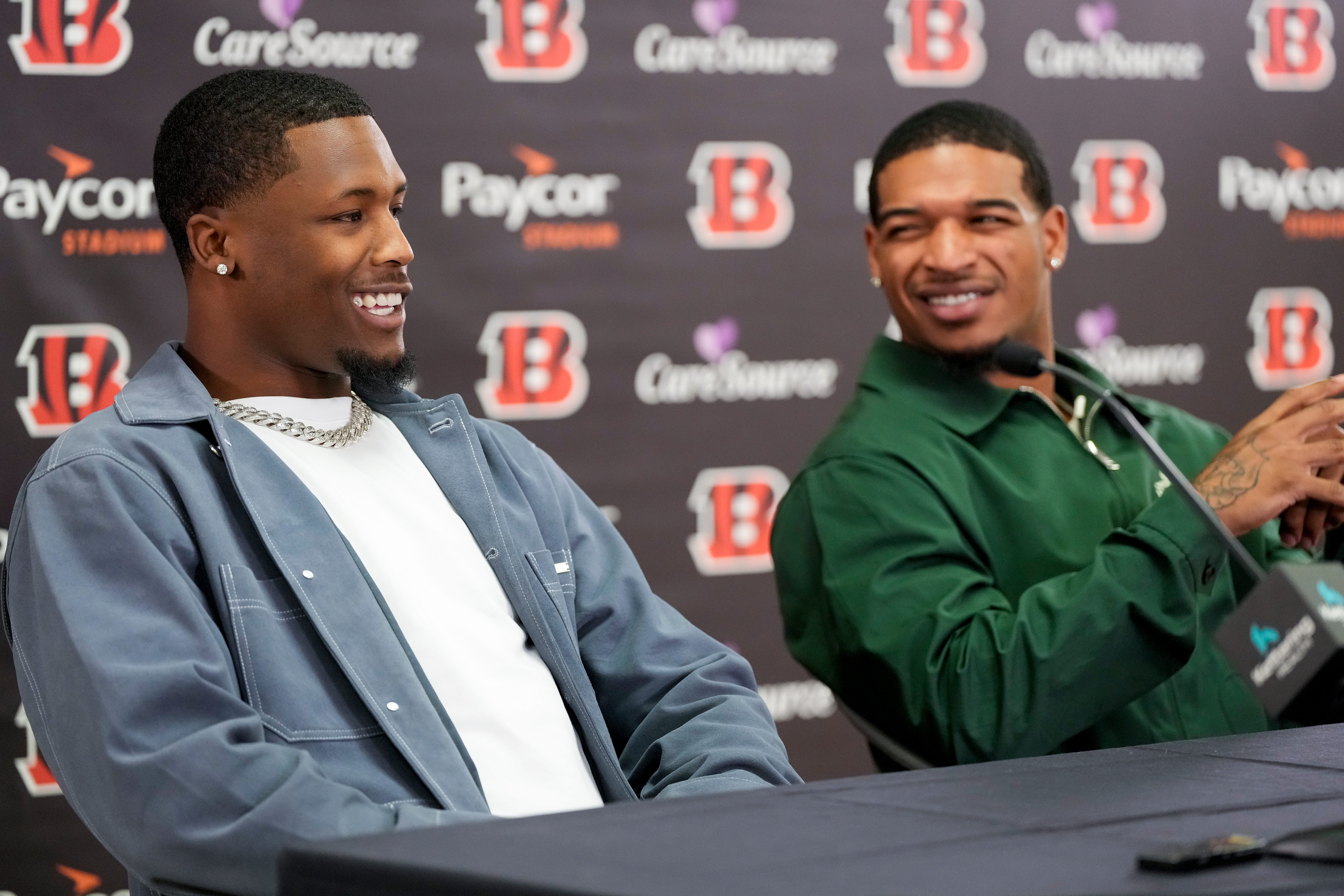 Ja’Marr Chase reacts to Tee Higgins saying he plans to send his new money on an aquarium built into the wall of his home during a press conference to announce the signing of new contracts for Cincinnati Bengals wide receivers Ja’Marr Chase and Tee Higgins at Paycor Stadium in downtown Cincinnati on Tuesday, March 18, 2025. Chase becomes the new highest-paid non-quarterback player in the NFL.