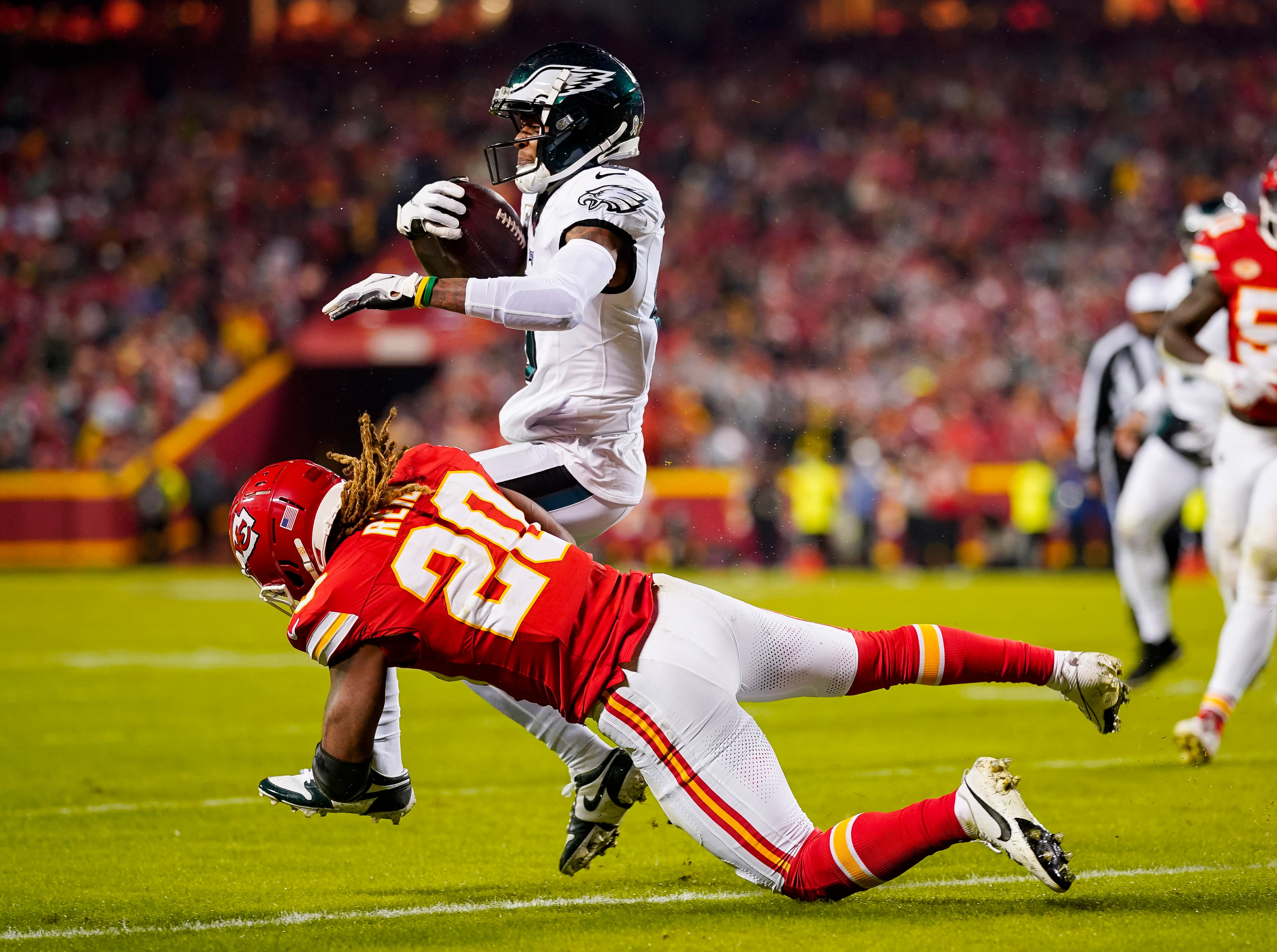Philadelphia Eagles wide receiver DeVonta Smith (6) is tackled by Kansas City Chiefs safety Justin Reid (20) during the second half at GEHA Field at Arrowhead Stadium.