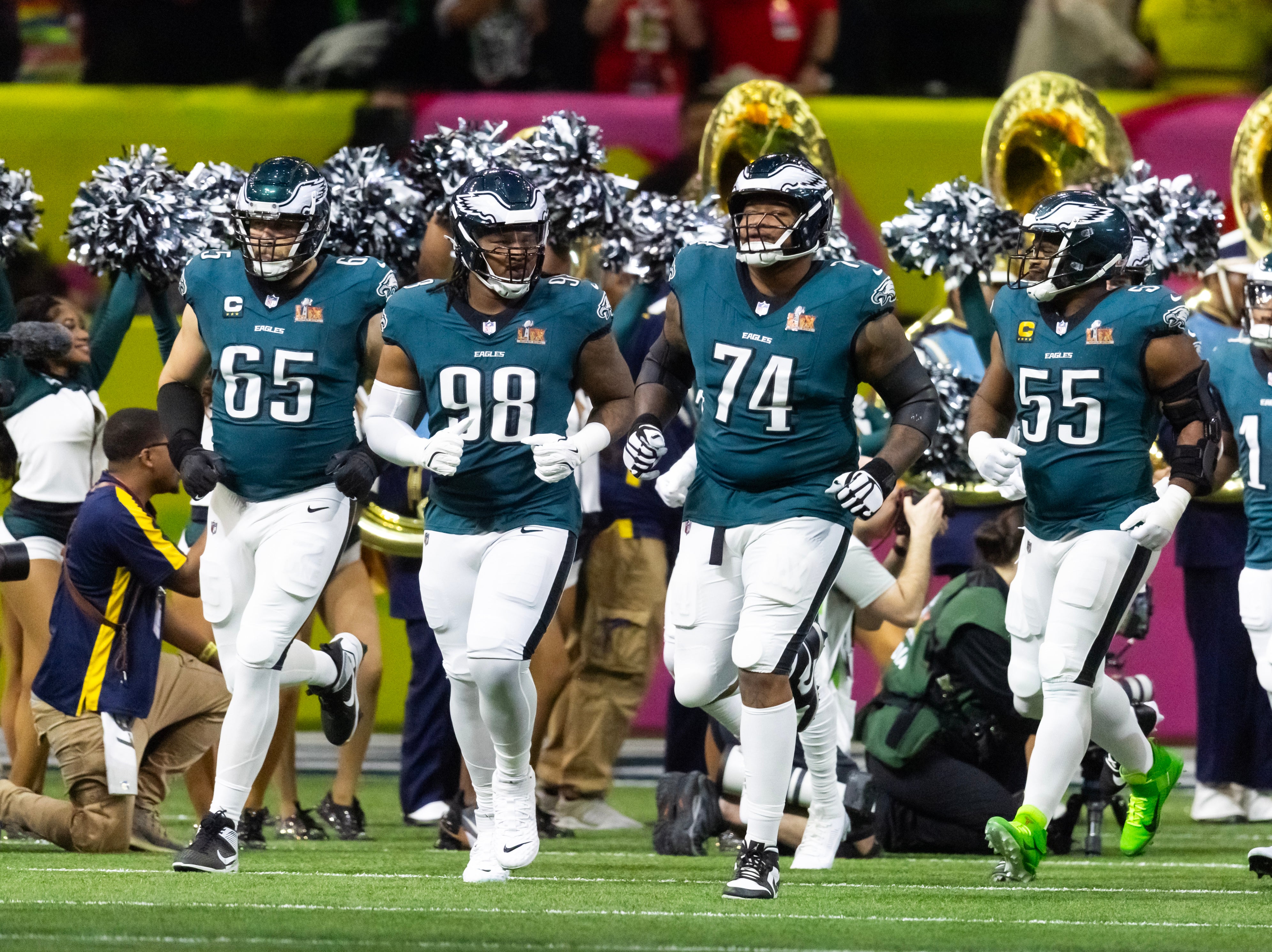 Philadelphia Eagles offensive tackle Lane Johnson (65), defensive end Jalen Carter (98), offensive tackle Fred Johnson (74) and defensive end Brandon Graham (55) enter the field prior to game.