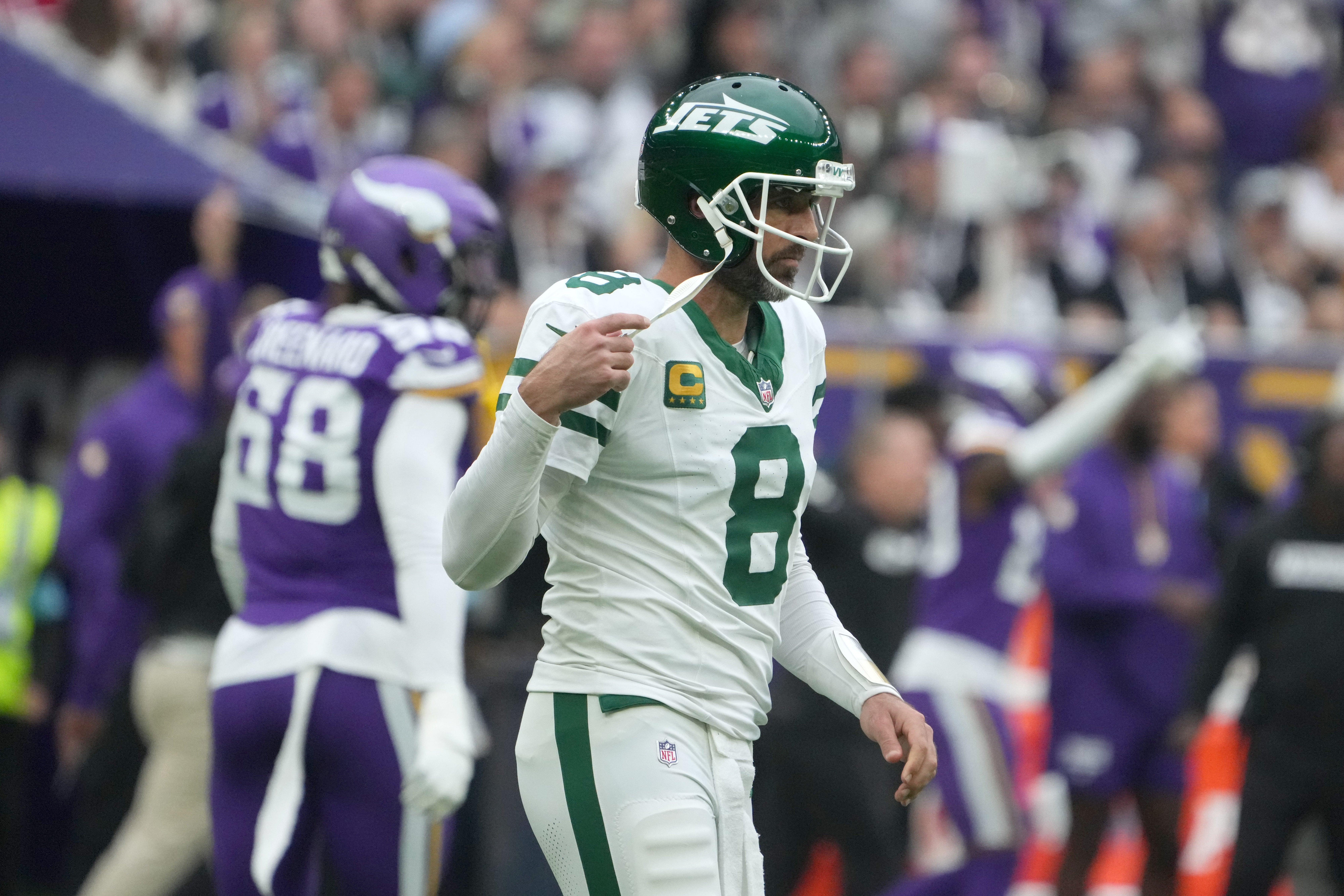 New York Jets quarterback Aaron Rodgers (8) reacts after throwing an interception against the Minnesota Vikings in the first half at Tottenham Hotspur Stadium.