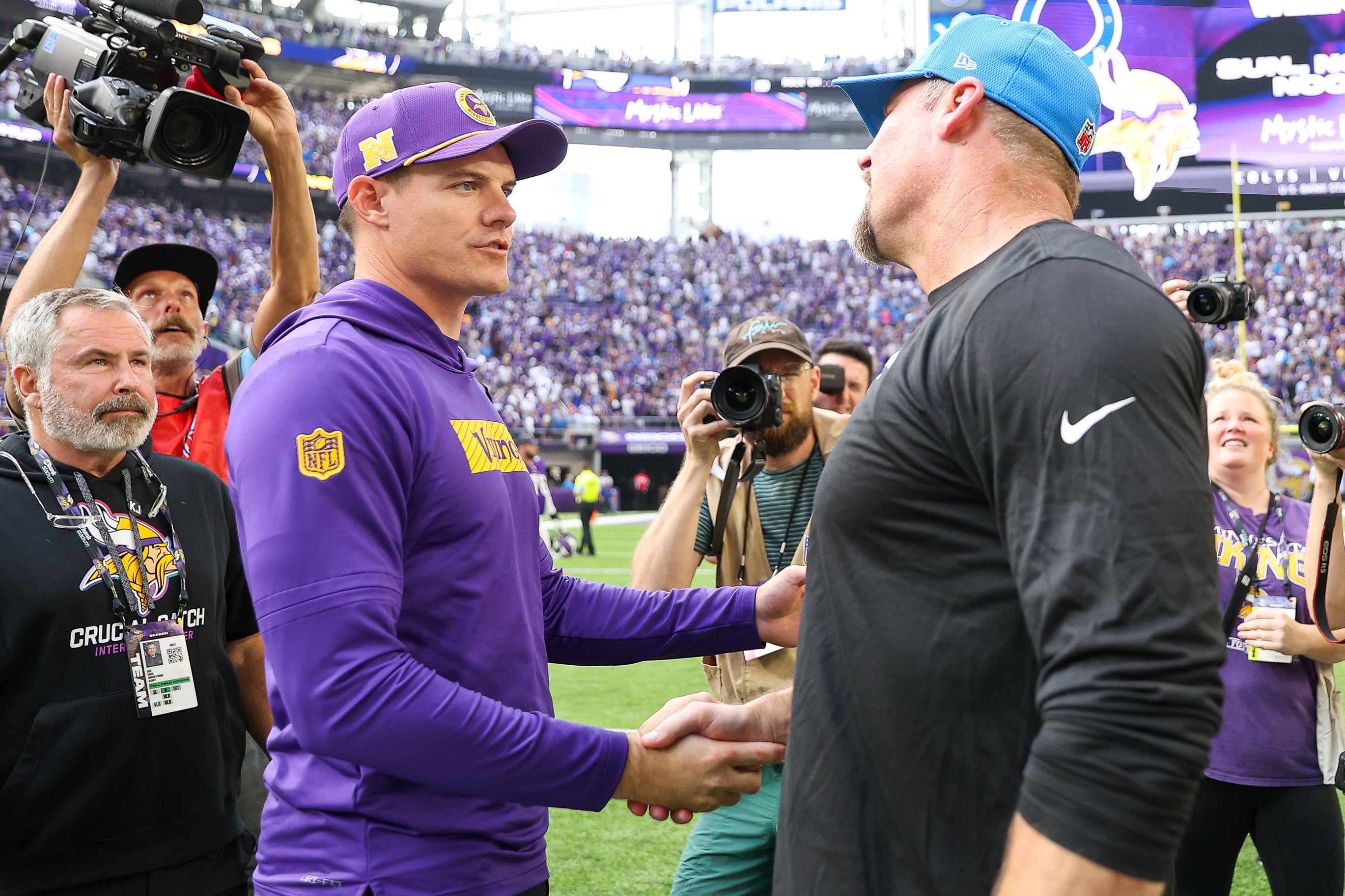 Oct 20, 2024; Minneapolis, Minnesota, USA; Minnesota Vikings head coach Kevin O'Connell and Detroit Lions head coach Dan Campbell shakes hands after the game at U.S. Bank Stadium.