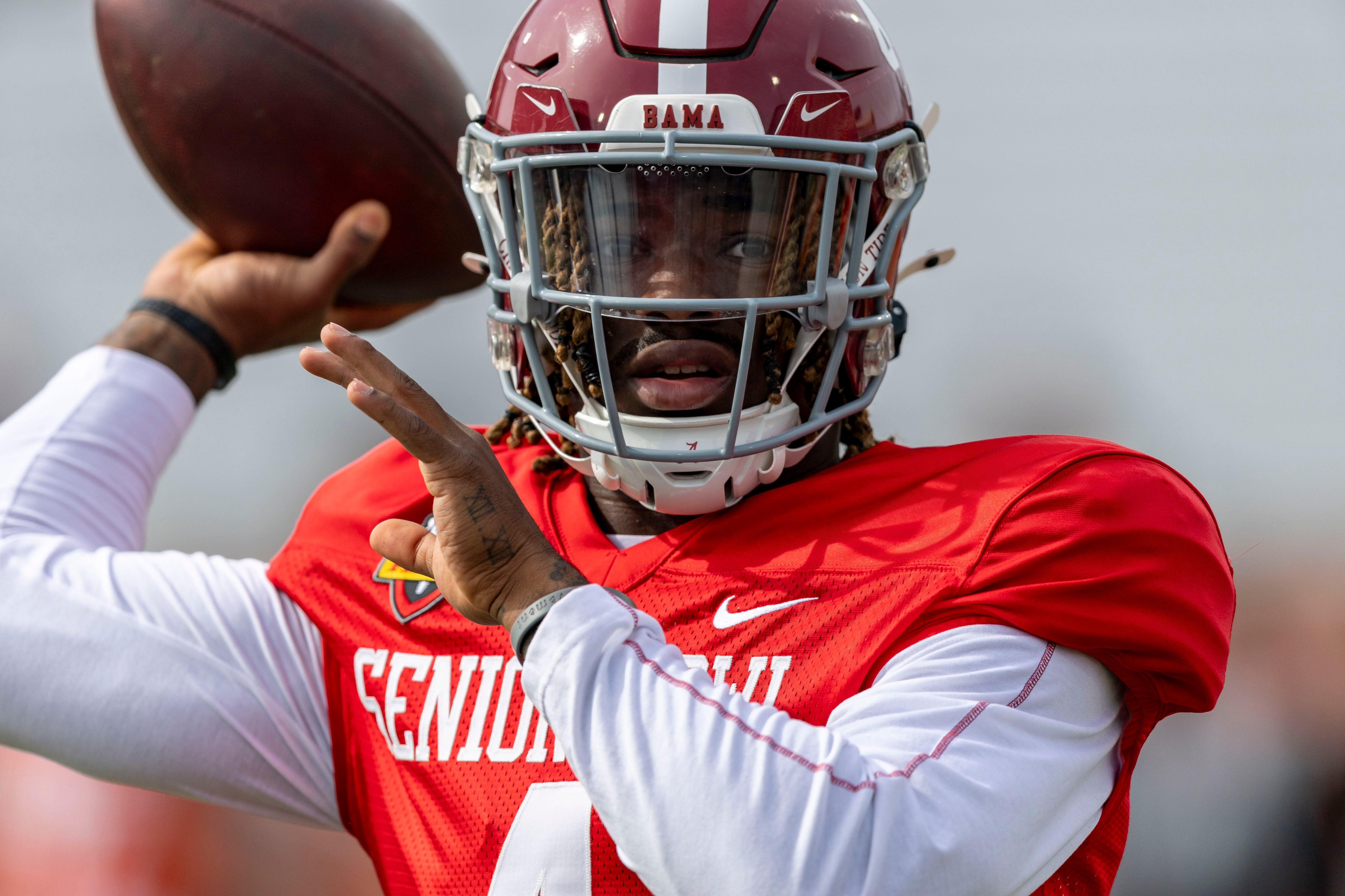 Jan 28, 2025; Mobile, AL, USA; American team quarterback Jalen Milroe of Alabama (4) throws the ball during Senior Bowl practice for the American team at Hancock Whitney Stadium.