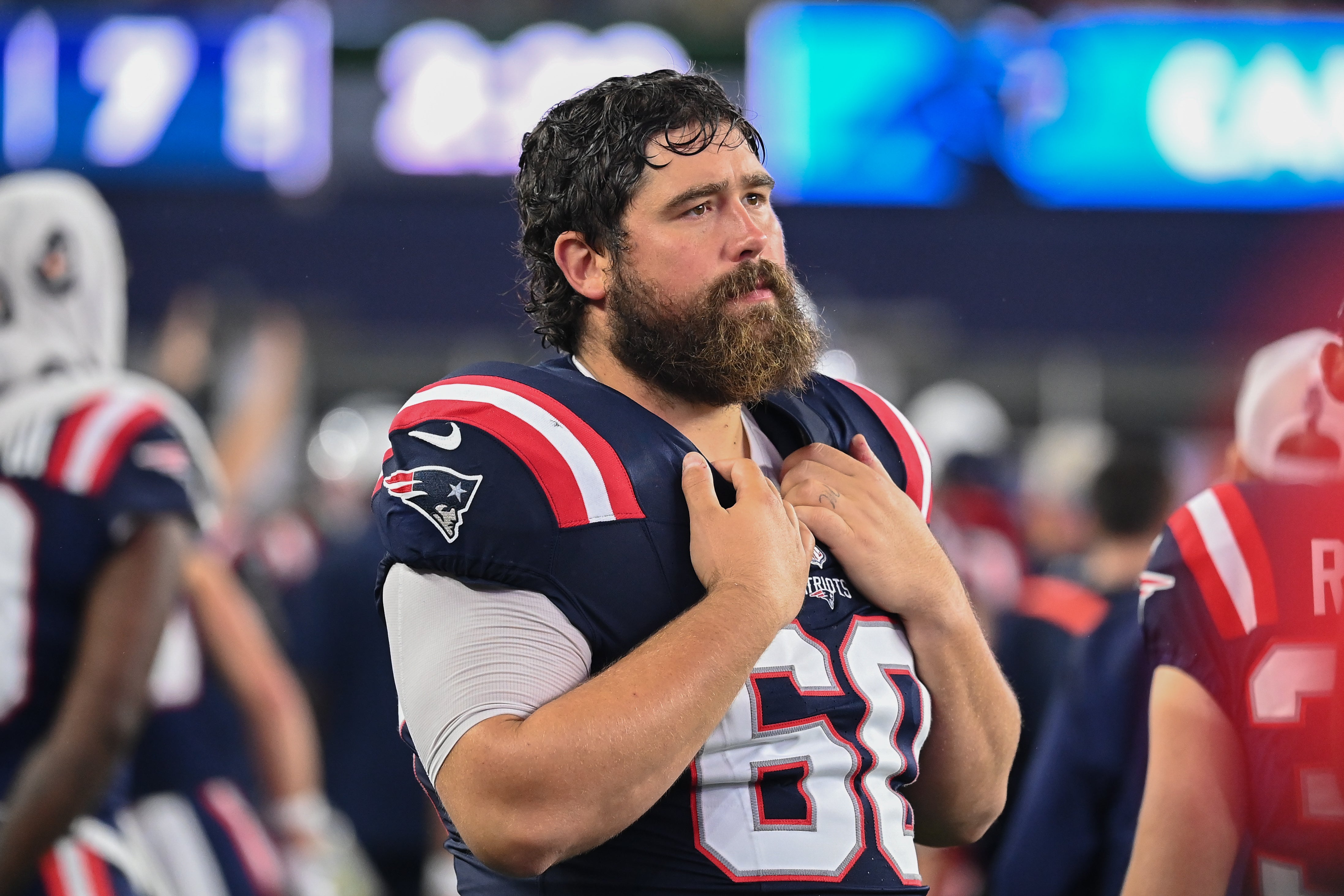 August 8, 2024; Foxborough, MA, USA; New England Patriots center David Andrews (60) watches from the sideline during the first half against the Carolina Panthers at Gillette Stadium.