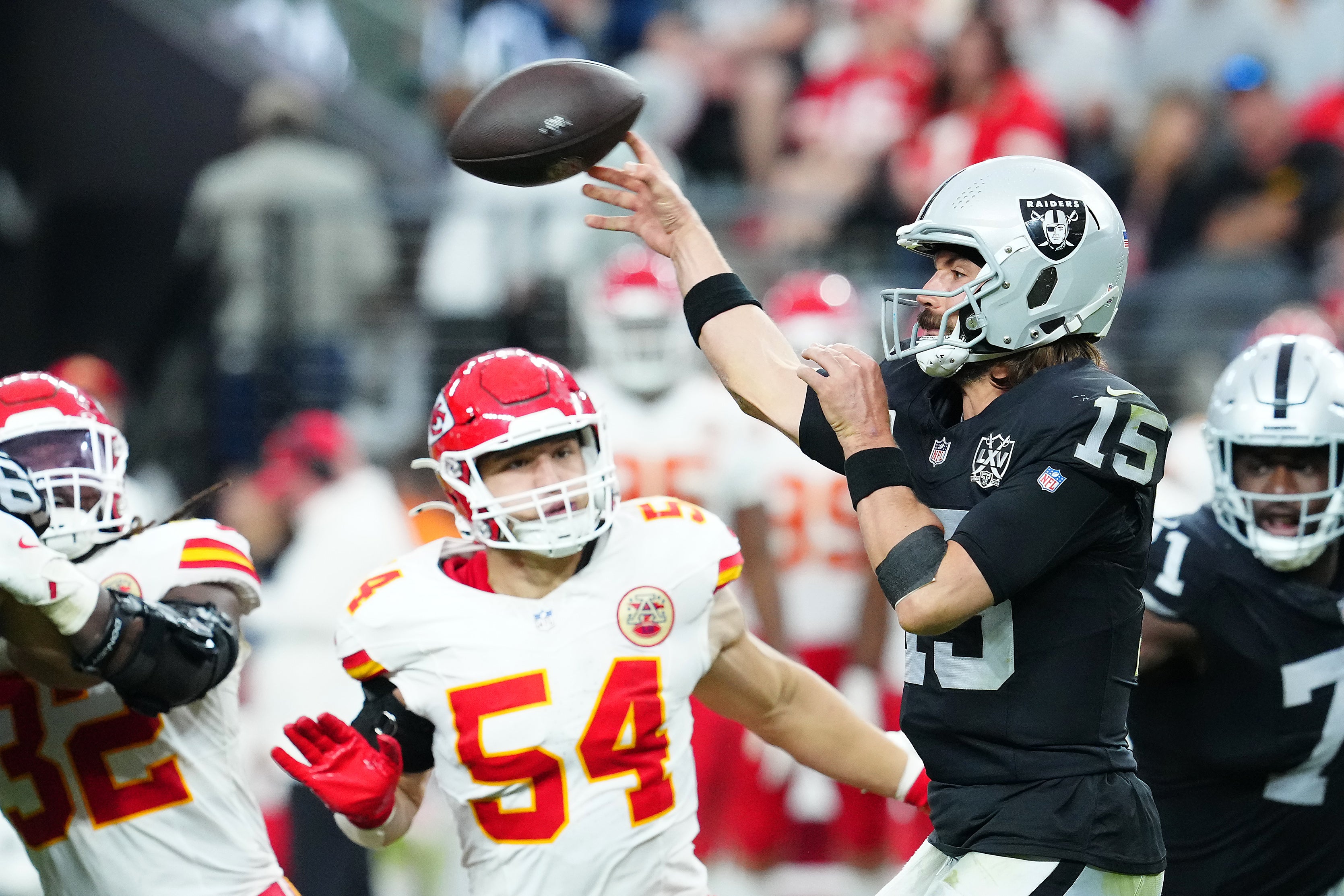 Oct 27, 2024; Paradise, Nevada, USA; Las Vegas Raiders quarterback Gardner Minshew (15) makes a pass attempt against the Kansas City Chiefs during the fourth quarter at Allegiant Stadium.