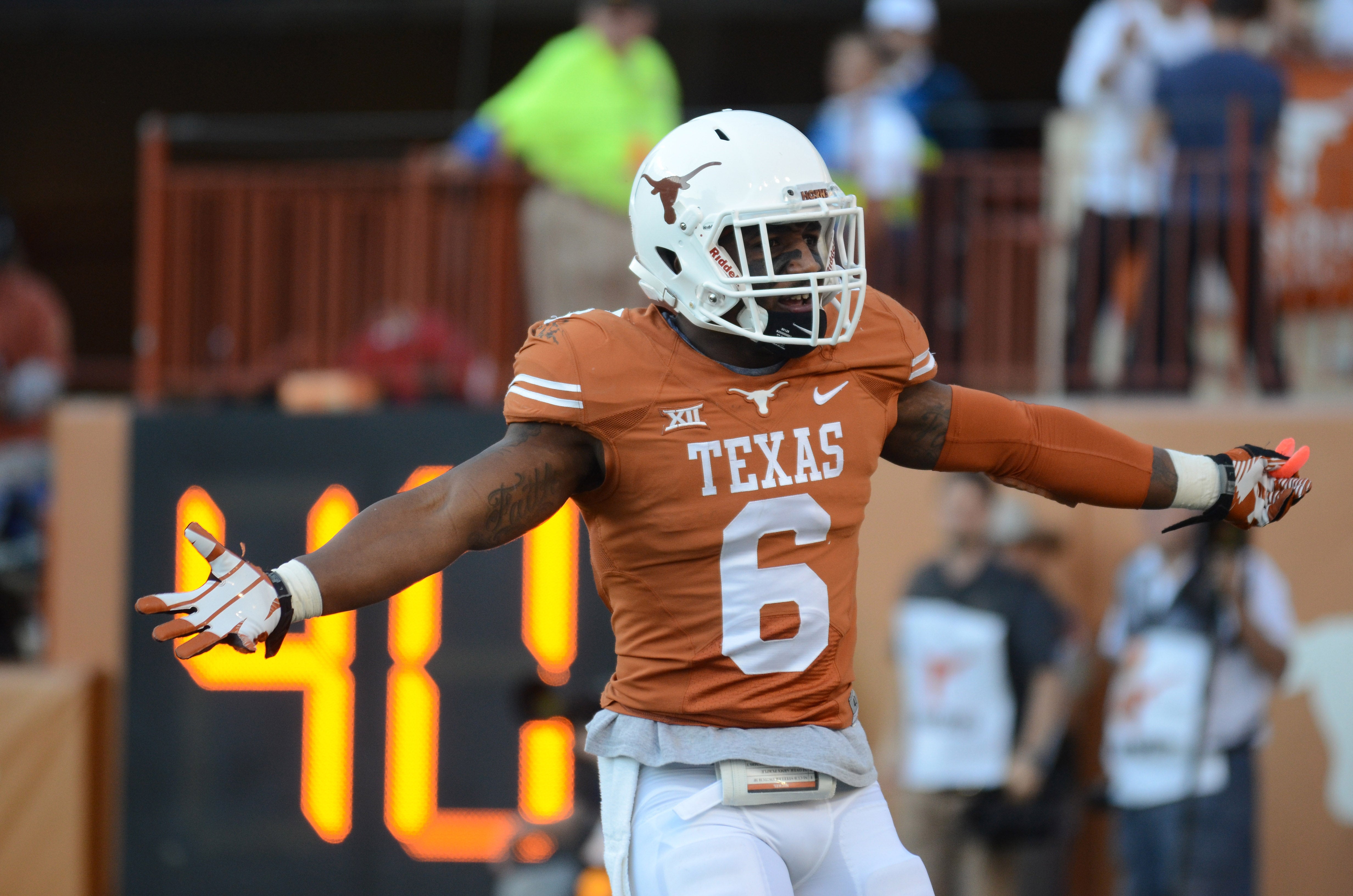Texas Longhorns corner back Quandre Diggs (6) reacts against the West Virginia Mountaineers during the second half at Darrell K Royal-Texas Memorial Stadium. Texas beat West Virginia 33-16.