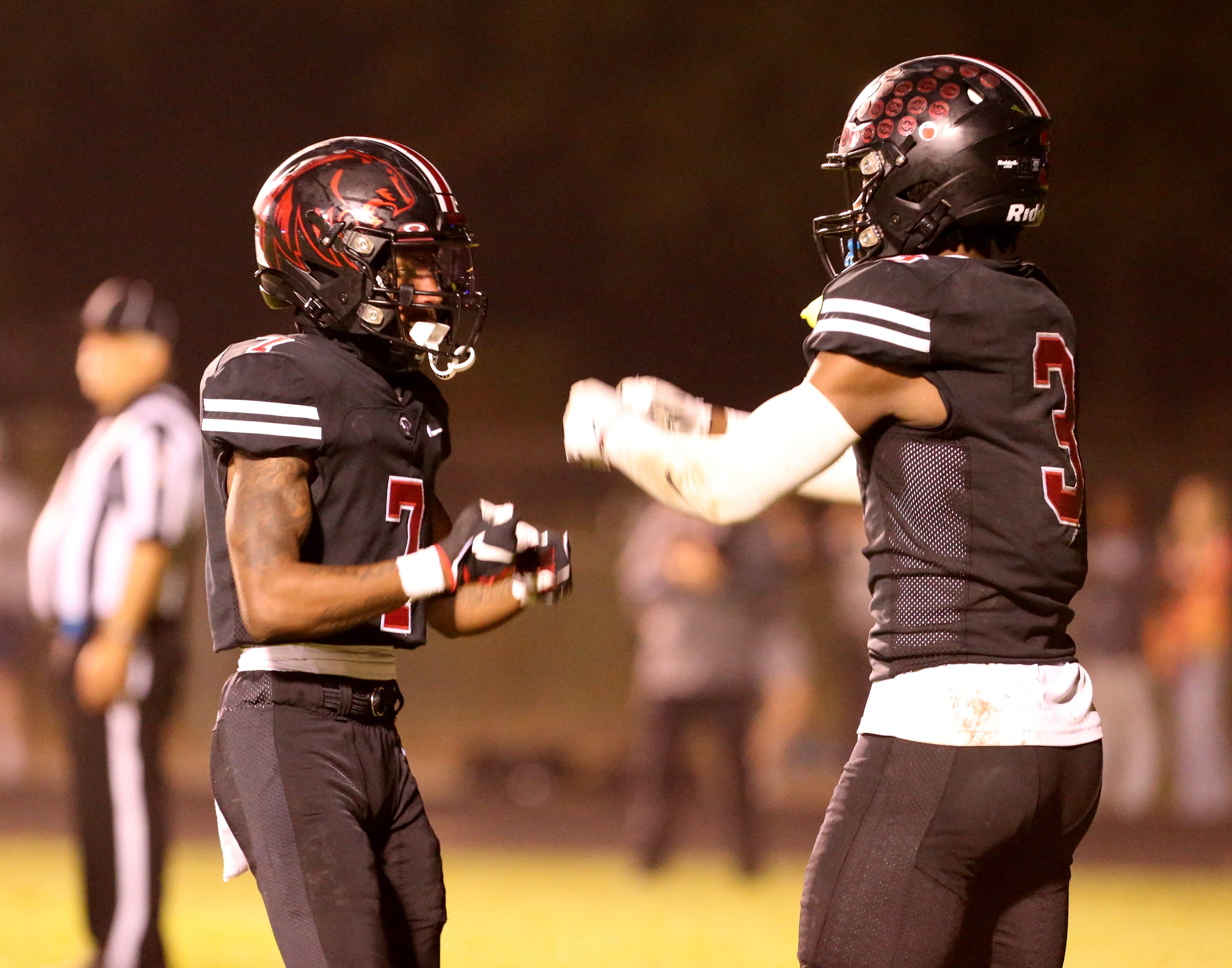 NorthWood players Trey Woods (7) celebrates with Nitro Tuggle (3) in overtime after Woods hauled in the winning touchdown during the Mishawaka vs. NorthWood football game Friday, Sept. 29, 2023, at Jim Andrews Field in Nappanee.