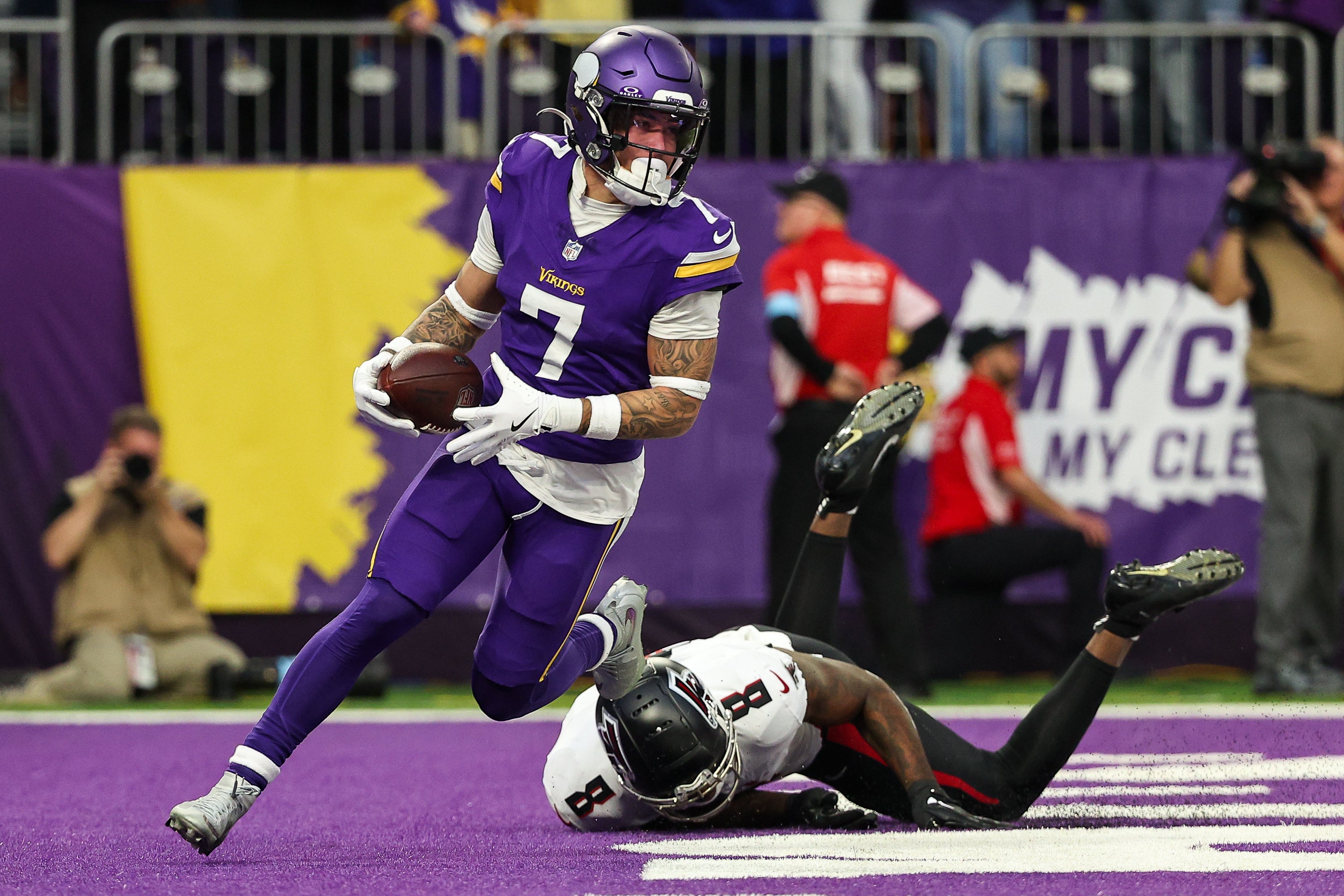 Dec 8, 2024; Minneapolis, Minnesota, USA; Minnesota Vikings cornerback Byron Murphy Jr. (7) intercepts a pass intended for Atlanta Falcons tight end Kyle Pitts (8) during the fourth quarter at U.S. Bank Stadium.