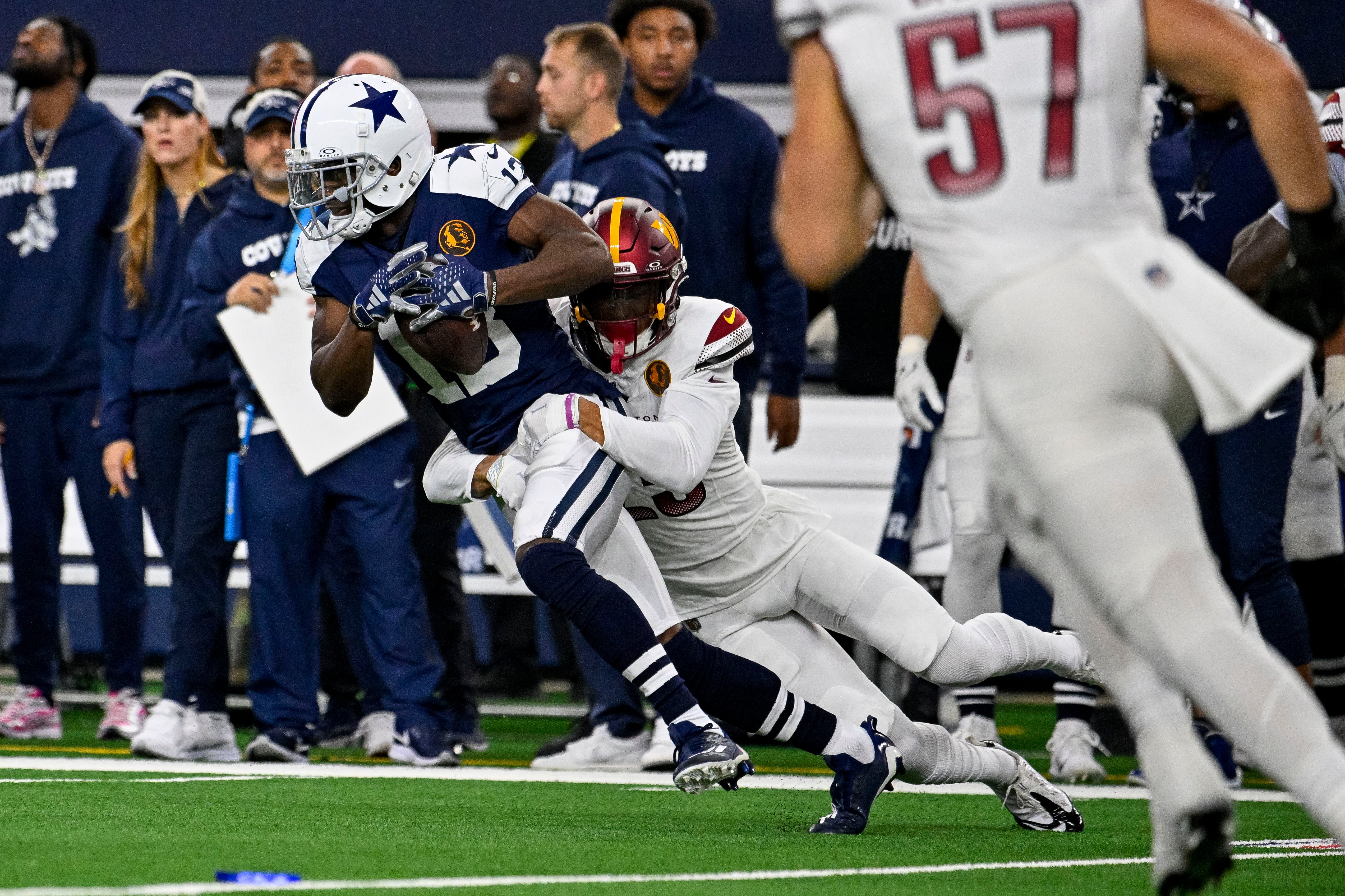 Dallas Cowboys wide receiver Michael Gallup (13) and Washington Commanders cornerback Benjamin St-Juste (25) in action during the game between the Dallas Cowboys and the Washington Commanders at AT&T Stadium.